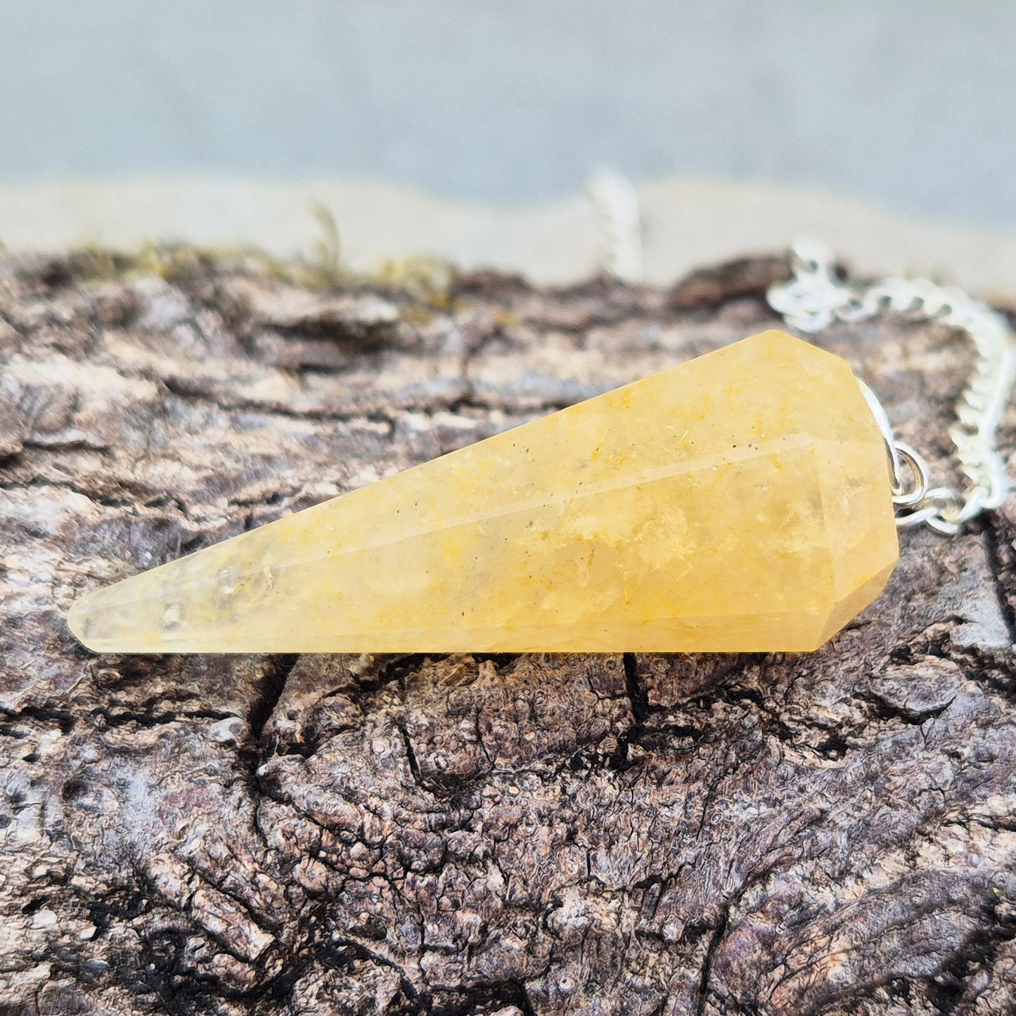 Golden Healer Quartz pendulum for energy work, dowsing, and intuitive guidance. Connects to gentle healing, balance, and spiritual growth.