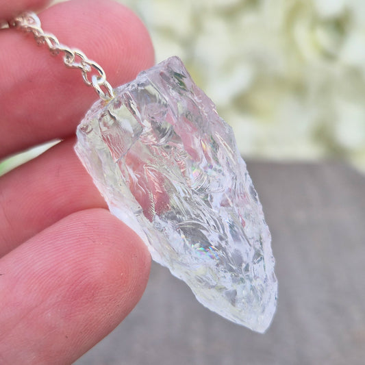 Rock Quartz Crystal Pendulum for dowsing and energy work. A versatile tool for guidance, decision-making, and spiritual connection. 