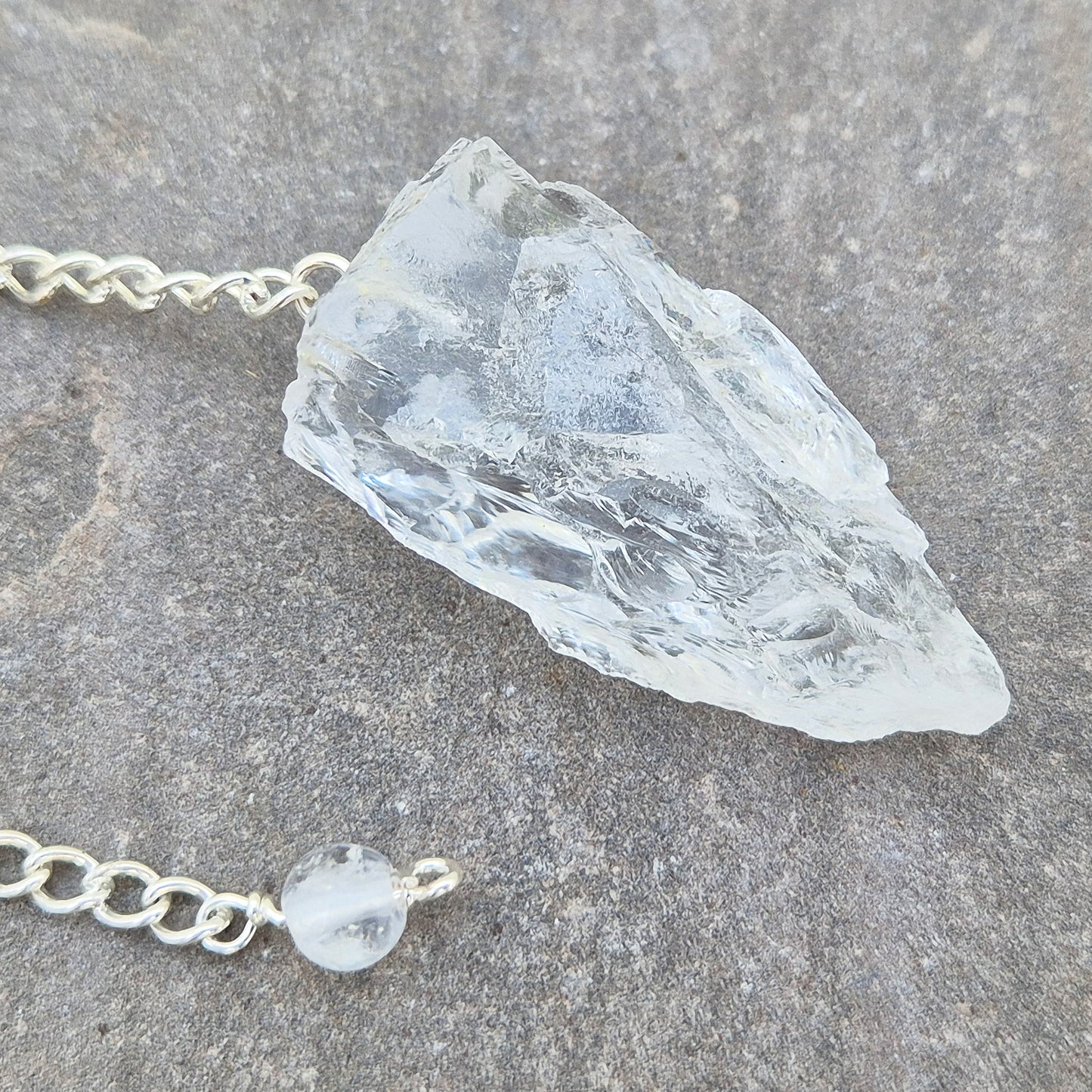 Rock Quartz Crystal Pendulum for dowsing and energy work. A versatile tool for guidance, decision-making, and spiritual connection. 