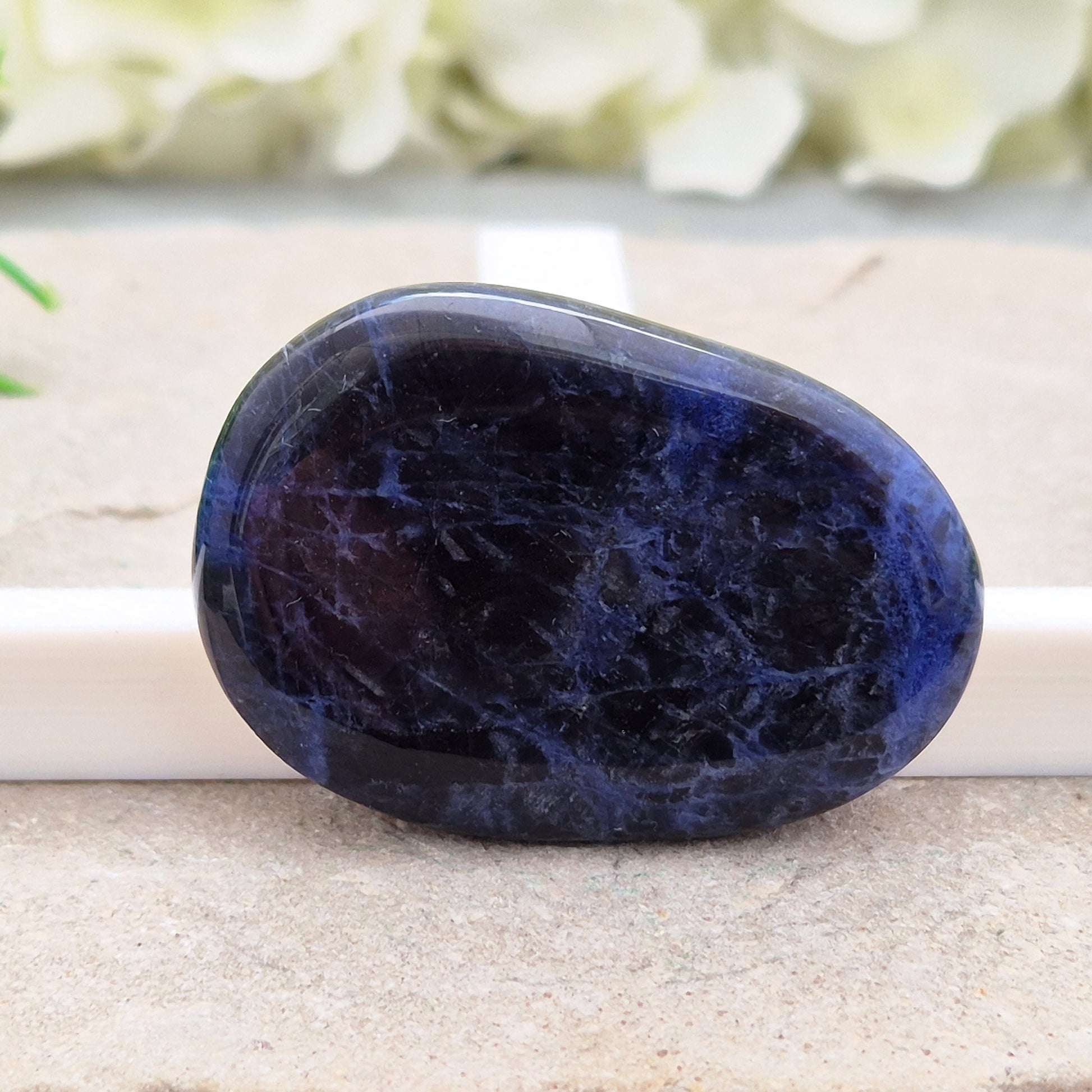 Beautiful A-grade Sodalite palm stone from Namibia. Supports clear thinking, confidence in communication, and emotional calm. Carry with you.