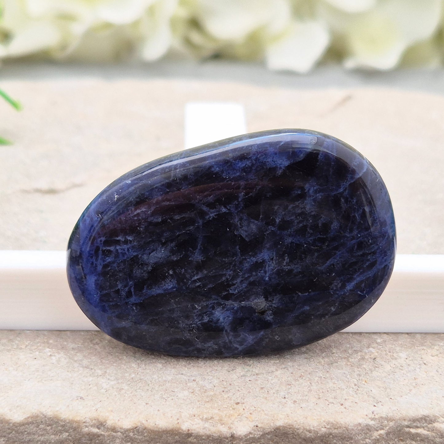 Beautiful A-grade Sodalite palm stone from Namibia. Supports clear thinking, confidence in communication, and emotional calm. Carry with you.