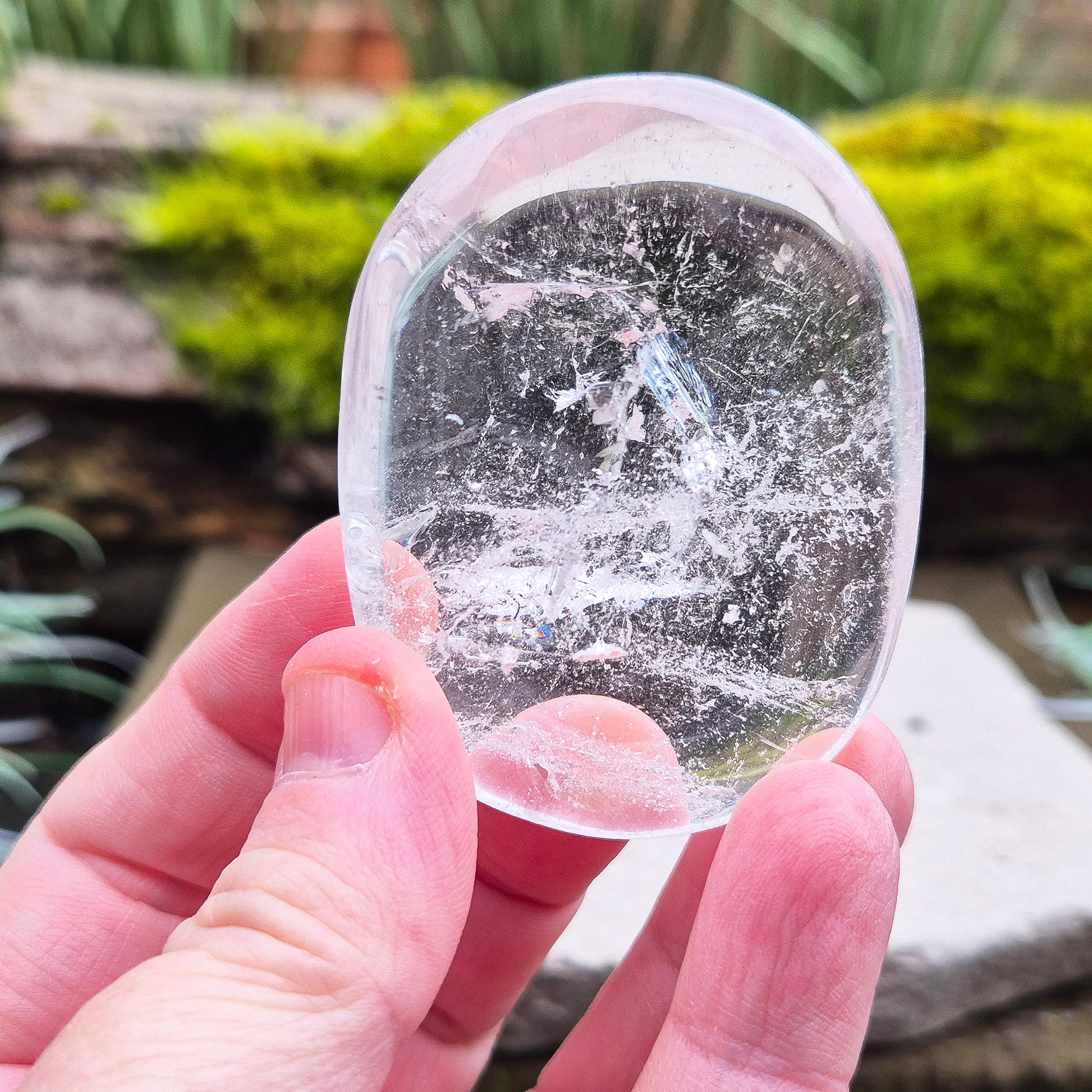 Quartz Crystal Palm Stone – A smooth, soothing stone that promotes clarity, calm, and positive energy, perfect for meditation or daily use. 
