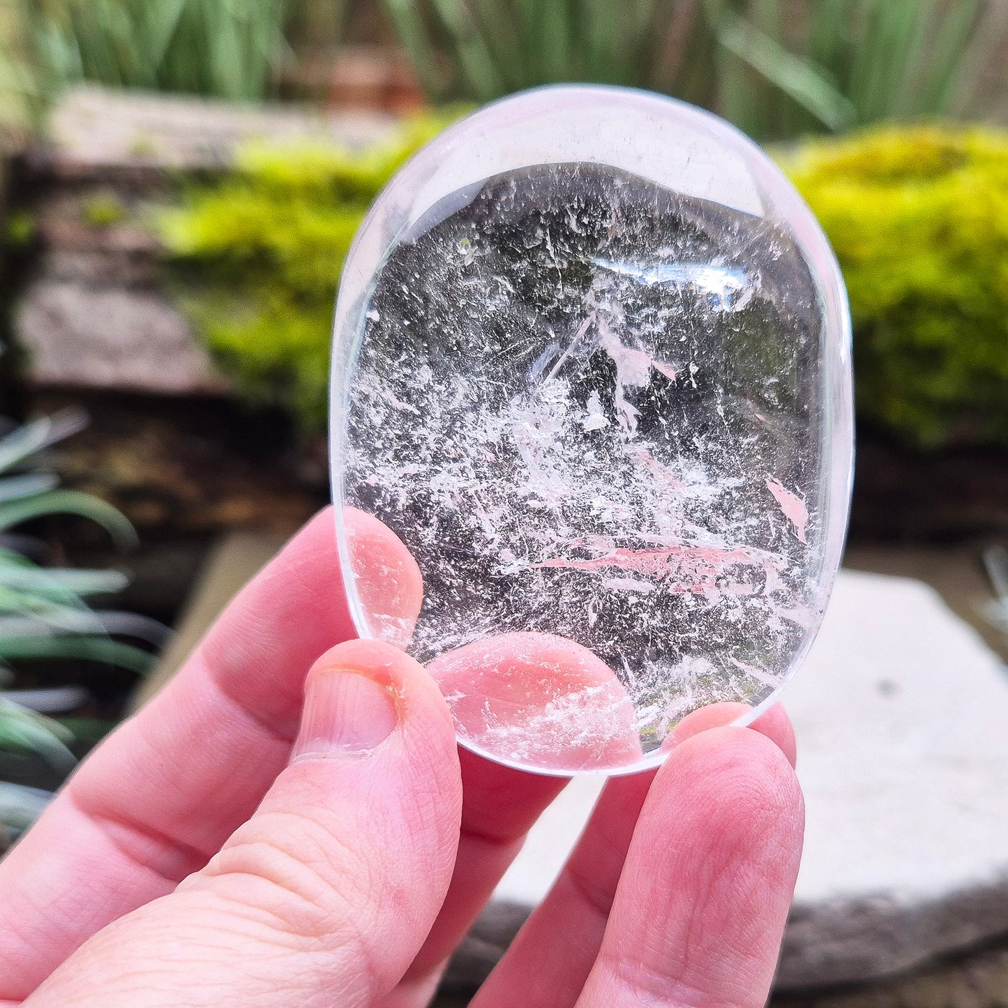 Quartz Crystal Palm Stone – A smooth, soothing stone that promotes clarity, calm, and positive energy, perfect for meditation or daily use. 