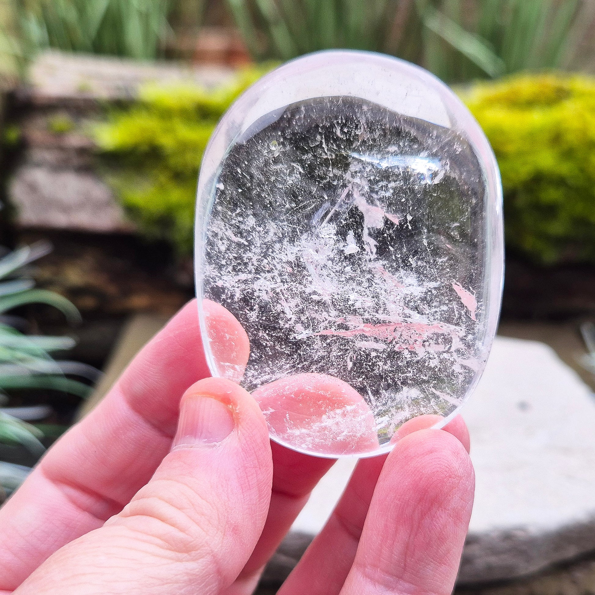 Quartz Crystal Palm Stone – A smooth, soothing stone that promotes clarity, calm, and positive energy, perfect for meditation or daily use. 