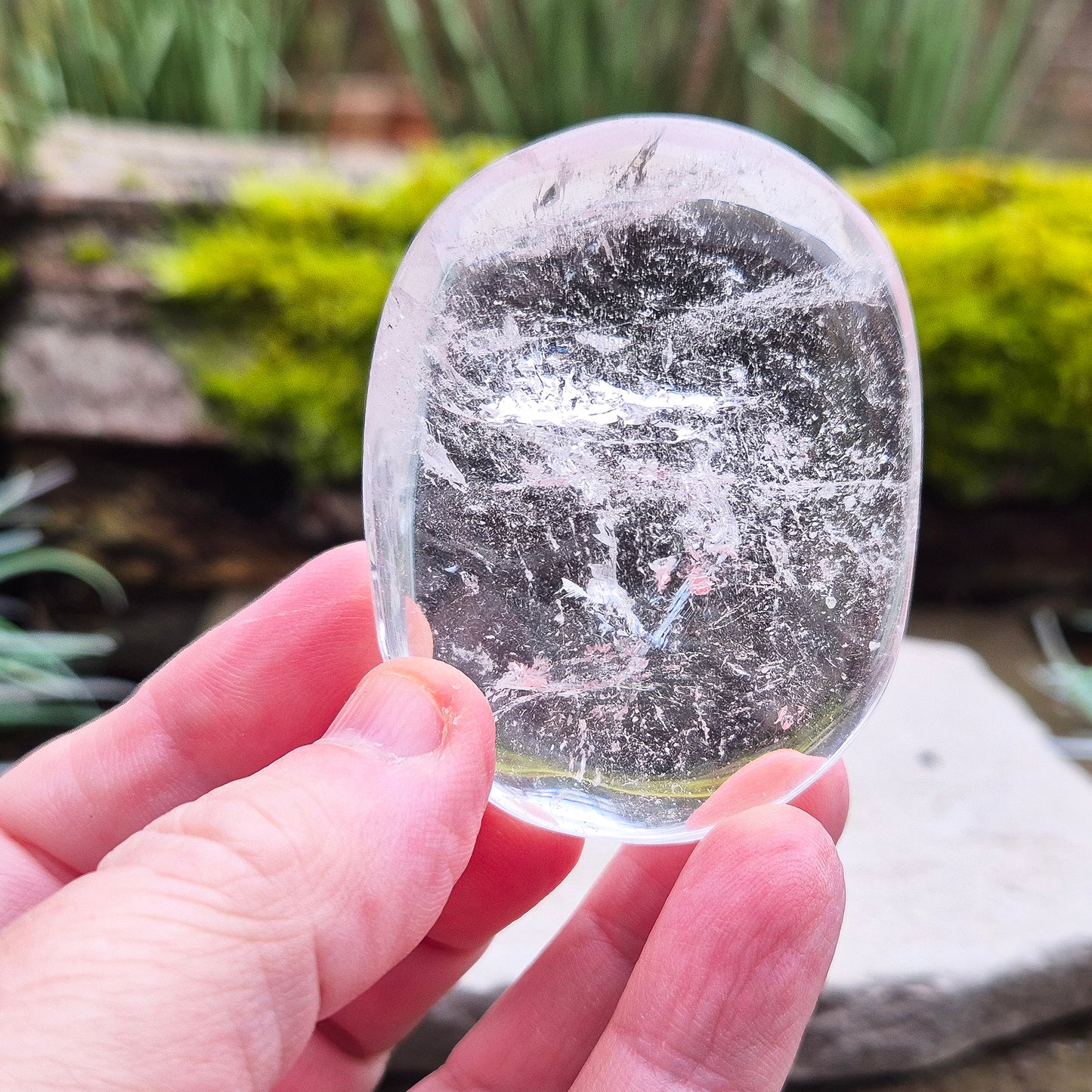 Quartz Crystal Palm Stone – A smooth, soothing stone that promotes clarity, calm, and positive energy, perfect for meditation or daily use. 