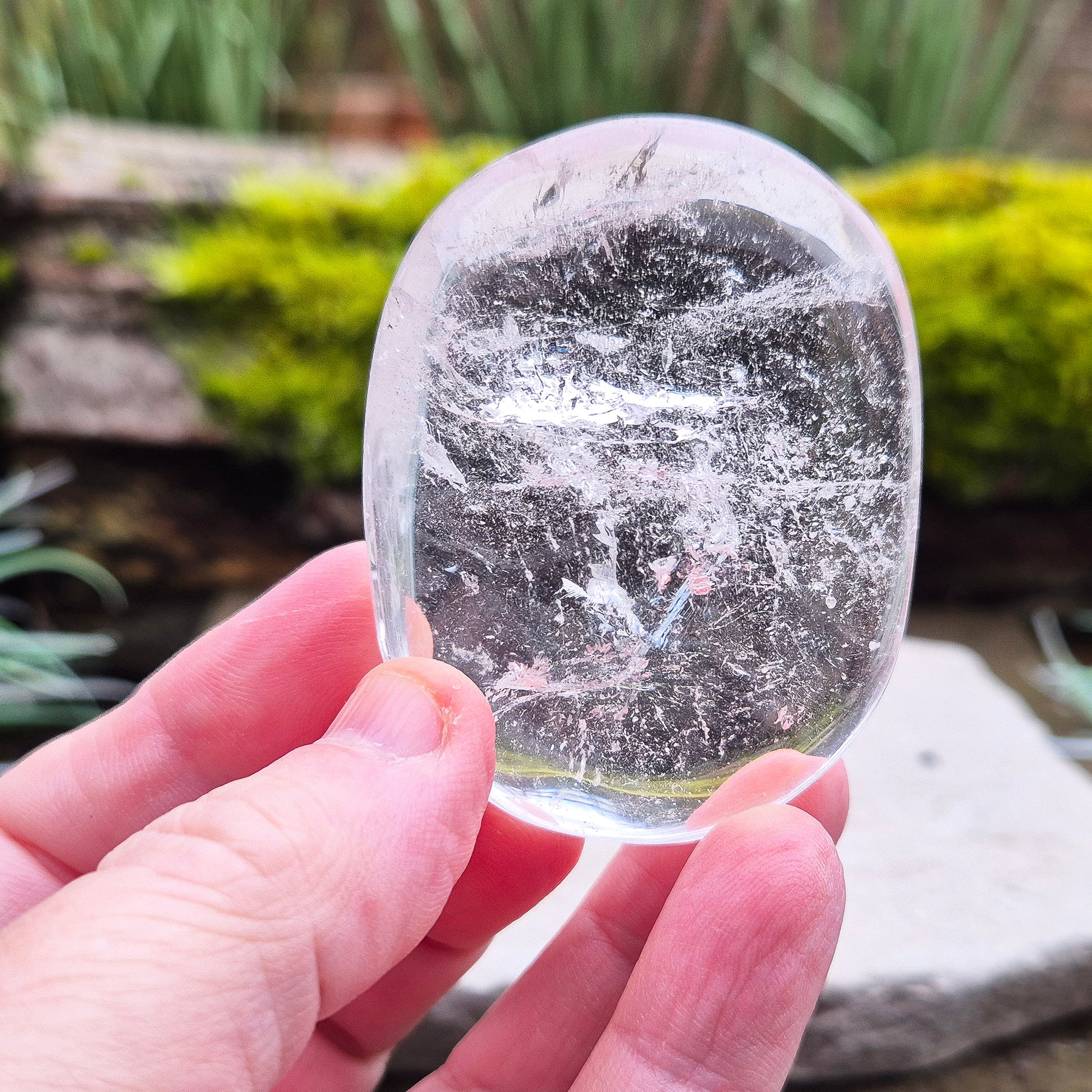 Quartz Crystal Palm Stone – A smooth, soothing stone that promotes clarity, calm, and positive energy, perfect for meditation or daily use. 