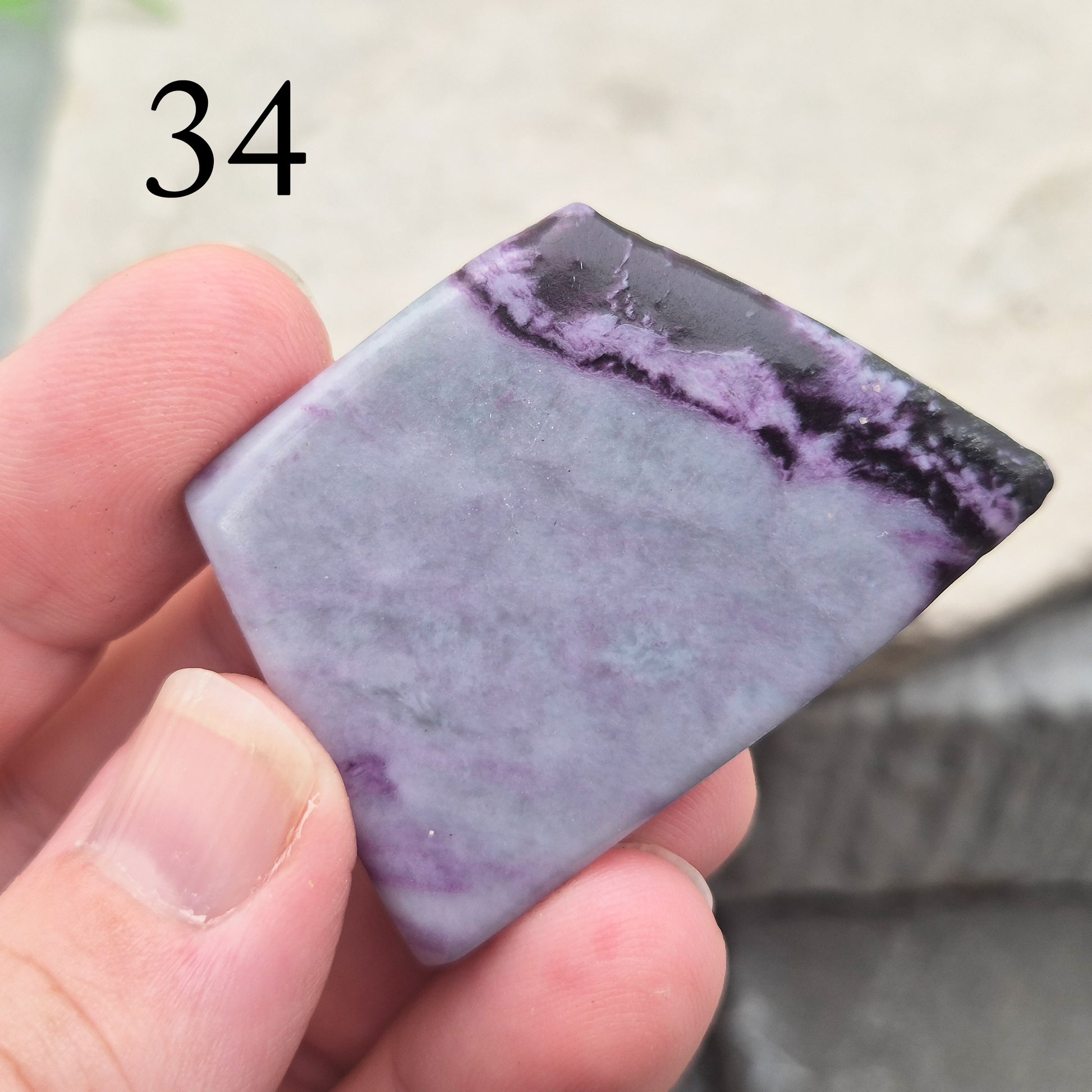This polished Kammererite crystal slice comes from Turkey and reveals rich violet-purple tones, often accented with natural green inclusions of Chromite, Chlorite, or Serpentine. Sometimes referred to as Purple Seraphinite, these flat slices are smooth, lightweight, and easy to hold or carry in a pocket.