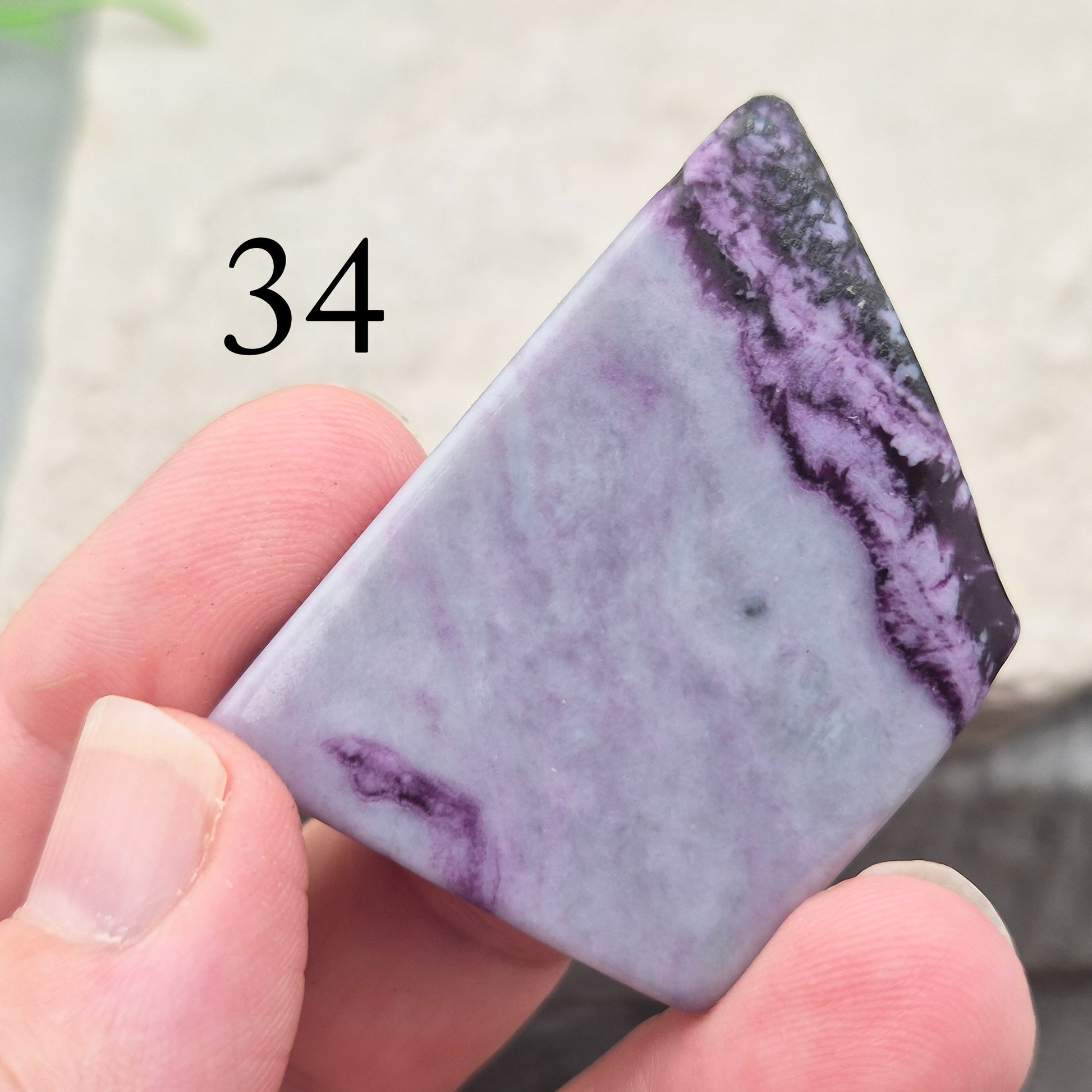 This polished Kammererite crystal slice comes from Turkey and reveals rich violet-purple tones, often accented with natural green inclusions of Chromite, Chlorite, or Serpentine. Sometimes referred to as Purple Seraphinite, these flat slices are smooth, lightweight, and easy to hold or carry in a pocket.