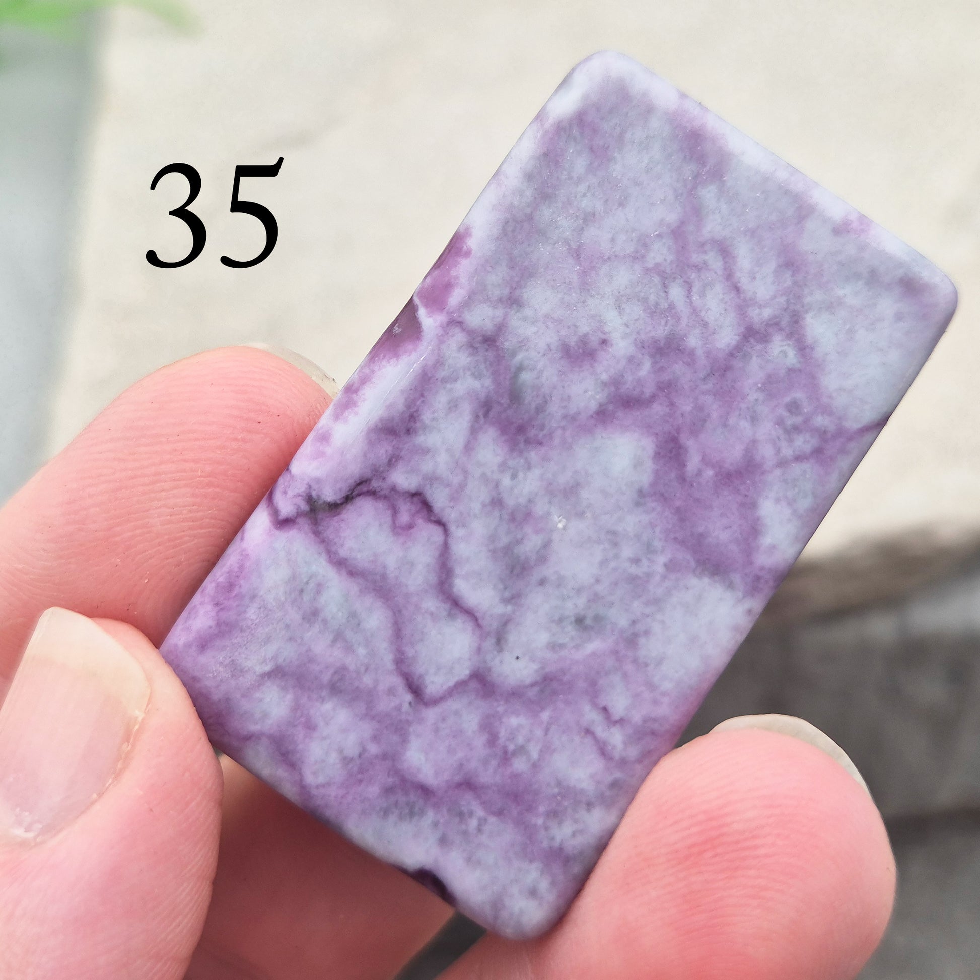 This polished Kammererite crystal slice comes from Turkey and reveals rich violet-purple tones, often accented with natural green inclusions of Chromite, Chlorite, or Serpentine. Sometimes referred to as Purple Seraphinite, these flat slices are smooth, lightweight, and easy to hold or carry in a pocket.
