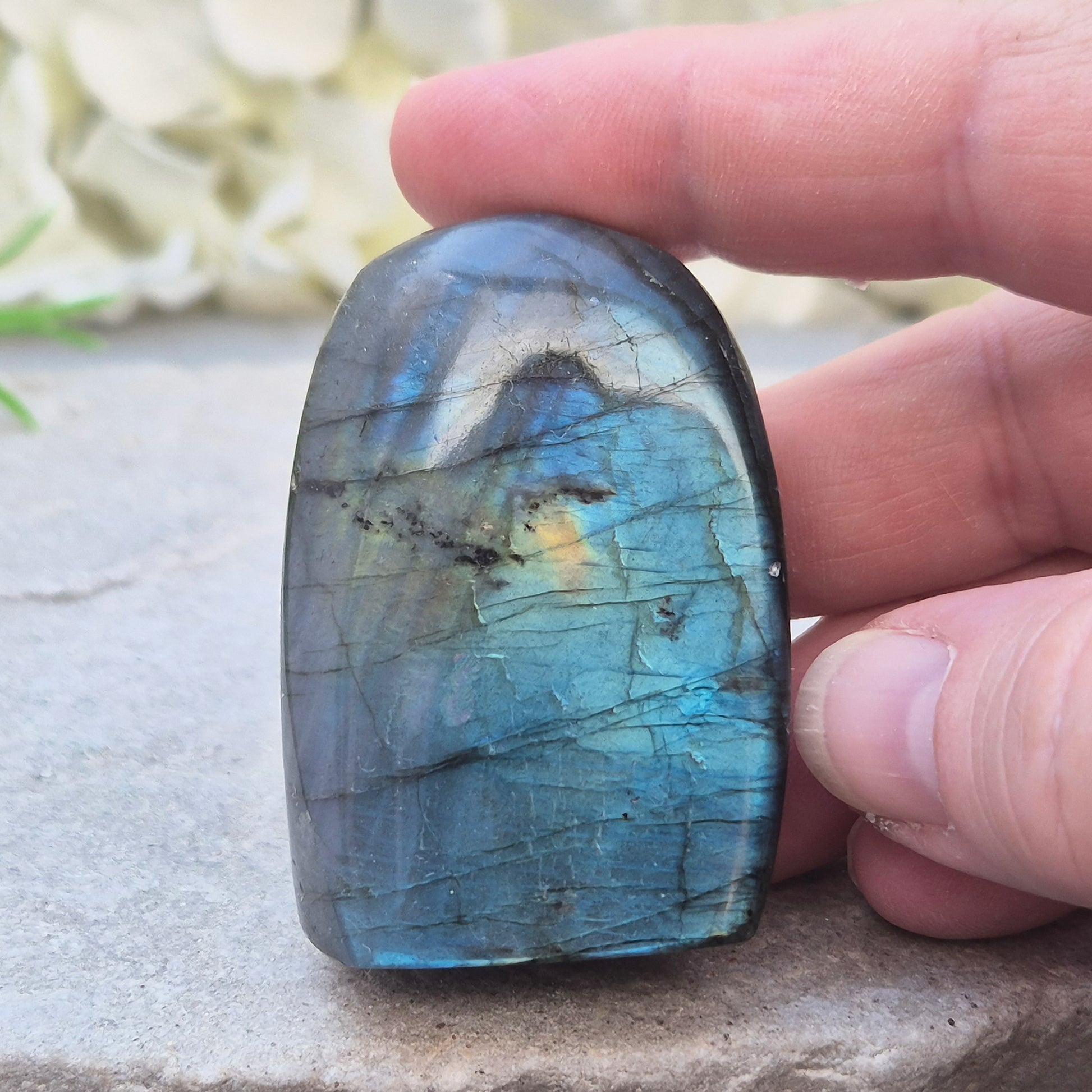 Labradorite Crystal Freeform with flashes of blue and yellow. Labradorite is often chosen during times of change, reflection, or personal growth. 