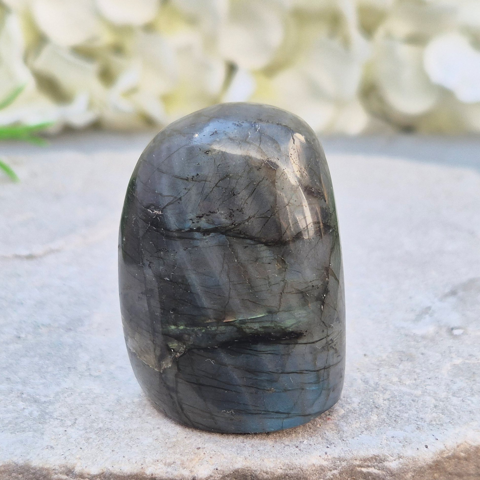 Labradorite Crystal Freeform with flashes of blue and yellow. Labradorite is often chosen during times of change, reflection, or personal growth. 