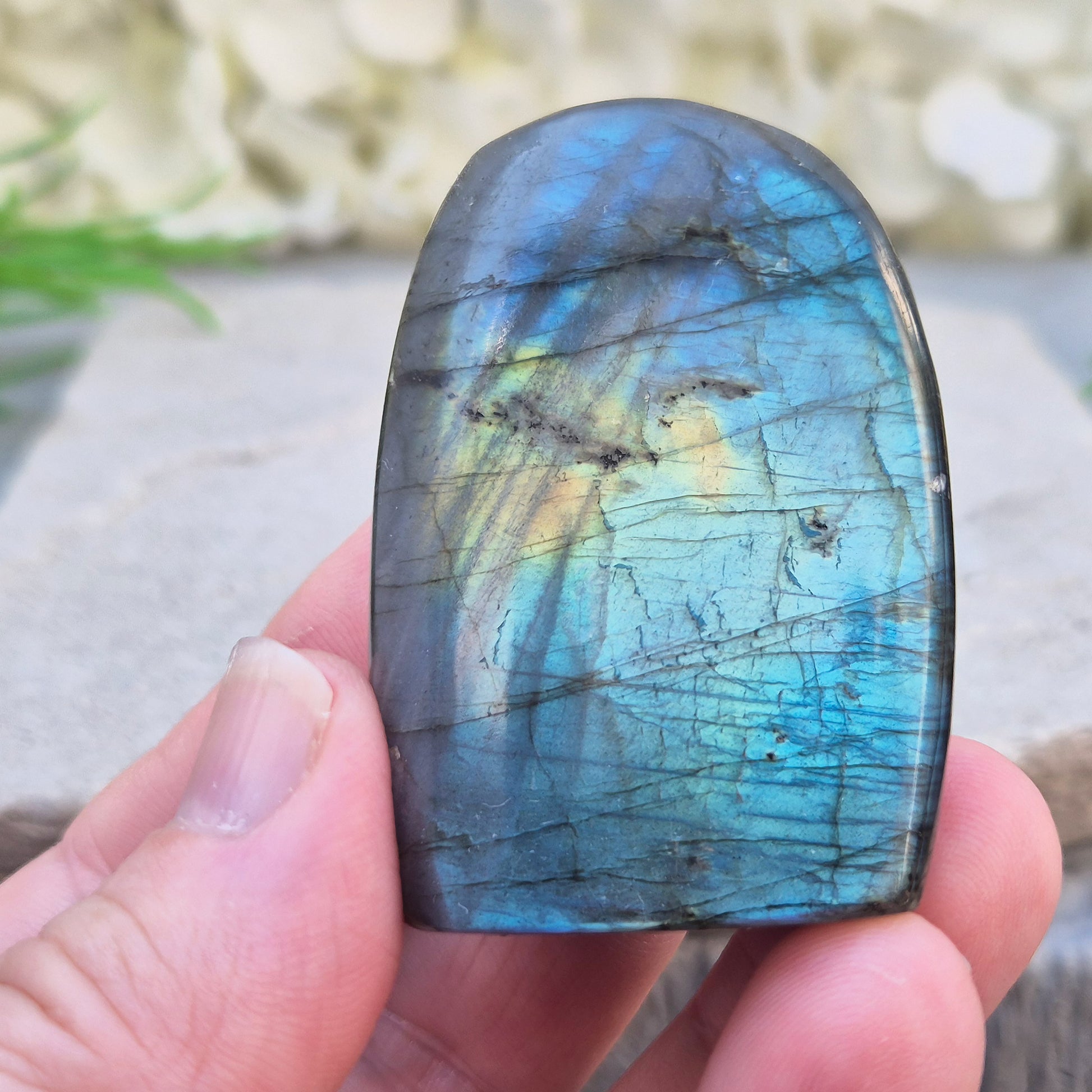 Labradorite Crystal Freeform with flashes of blue and yellow. Labradorite is often chosen during times of change, reflection, or personal growth. 