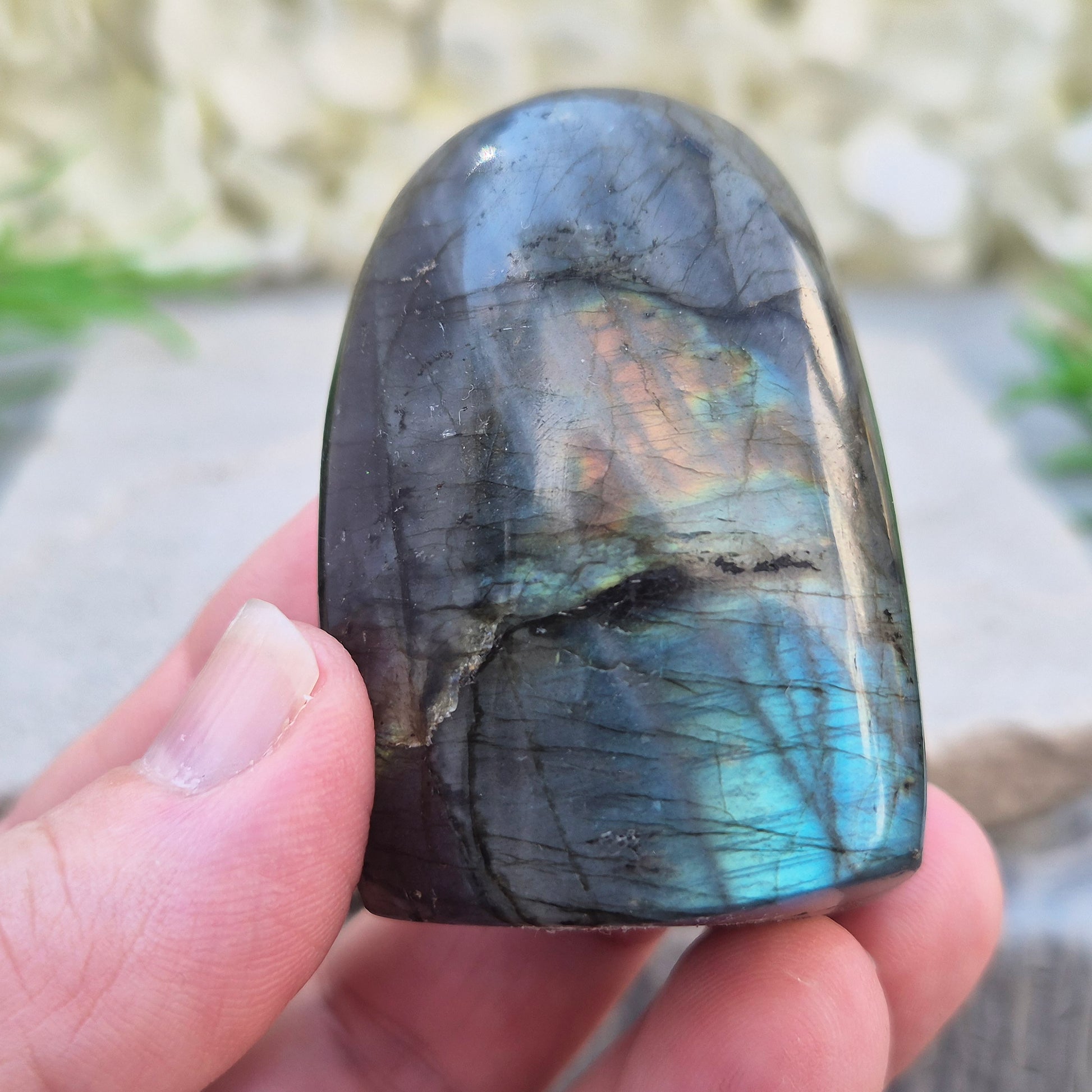 Labradorite Crystal Freeform with flashes of blue and yellow. Labradorite is often chosen during times of change, reflection, or personal growth. 