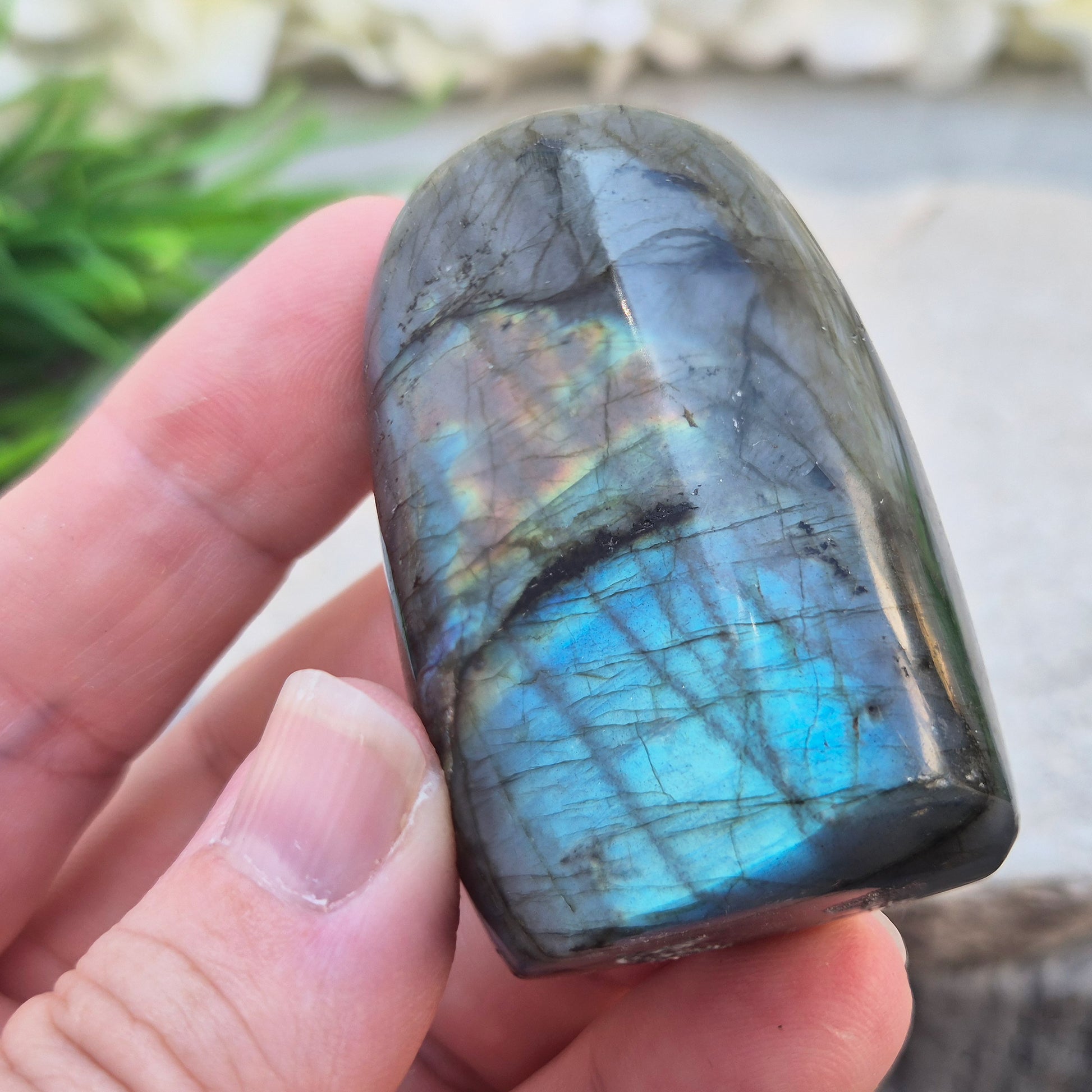 Labradorite Crystal Freeform with flashes of blue and yellow. Labradorite is often chosen during times of change, reflection, or personal growth. 