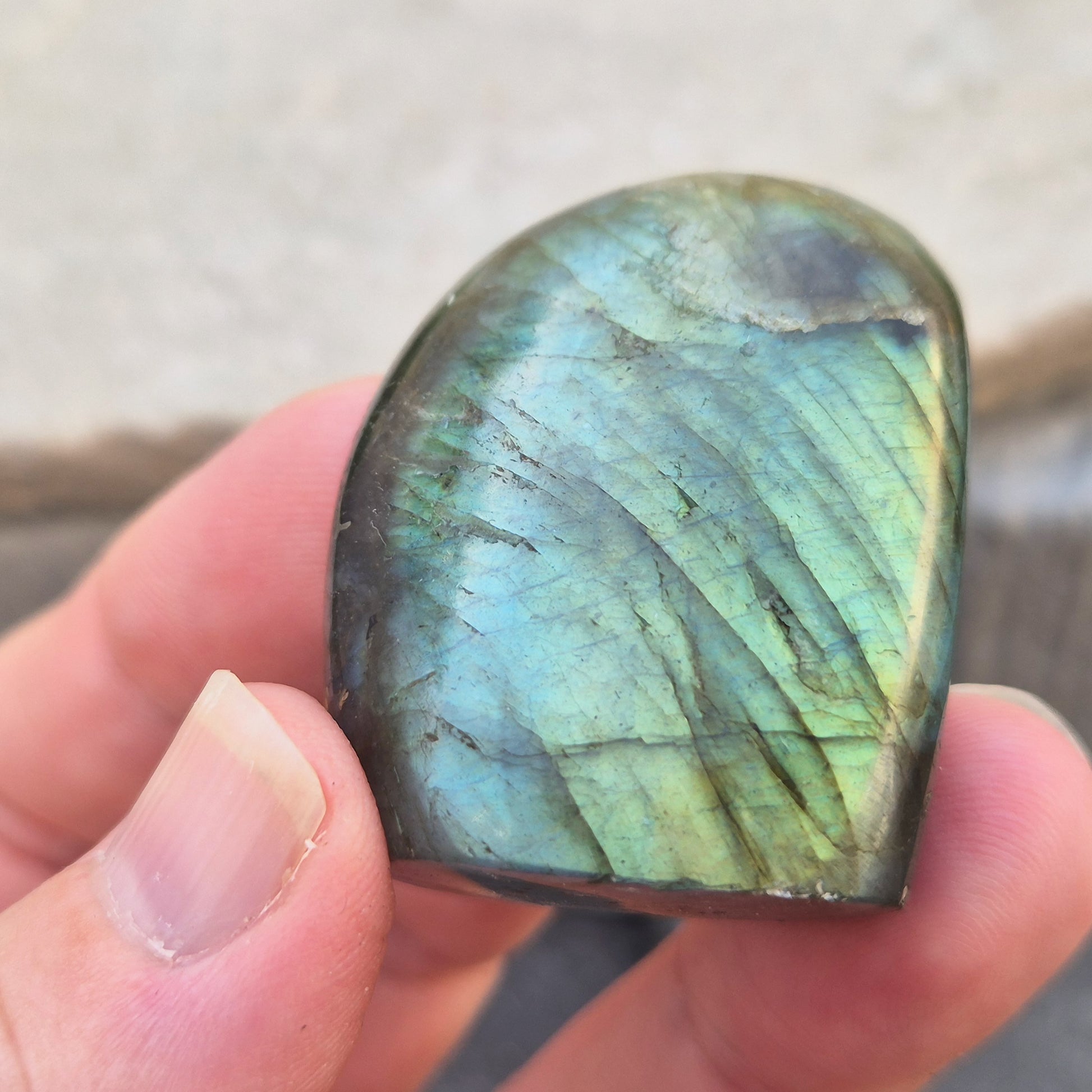 Labradorite freeform crystal with flashes of colour. Supports intuition, focus, and spiritual balance. Perfect for display or energy work.