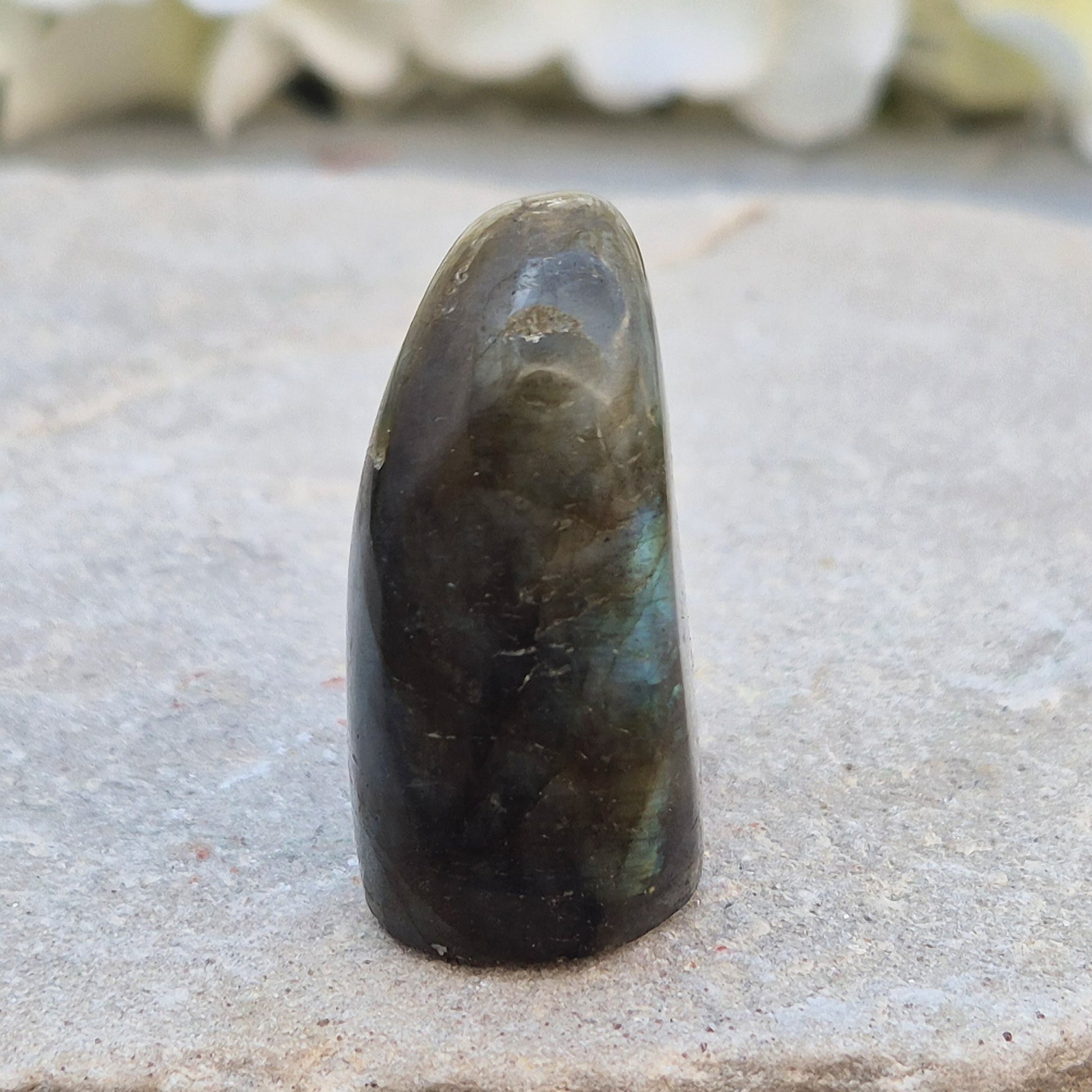 Labradorite freeform crystal with flashes of colour. Supports intuition, focus, and spiritual balance. Perfect for display or energy work.