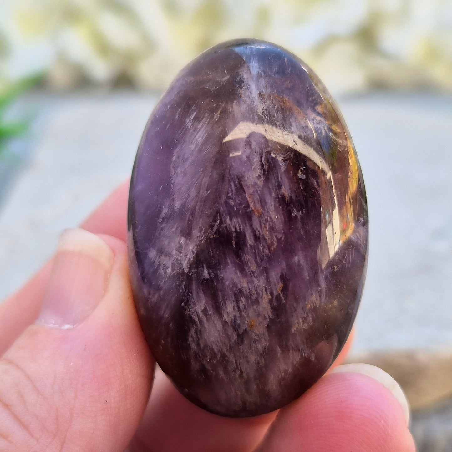 Natural Ametrine palm stone with subtle colour mix and organic inclusions. A smooth, easy-to-hold crystal for focus, balance, and direction. 