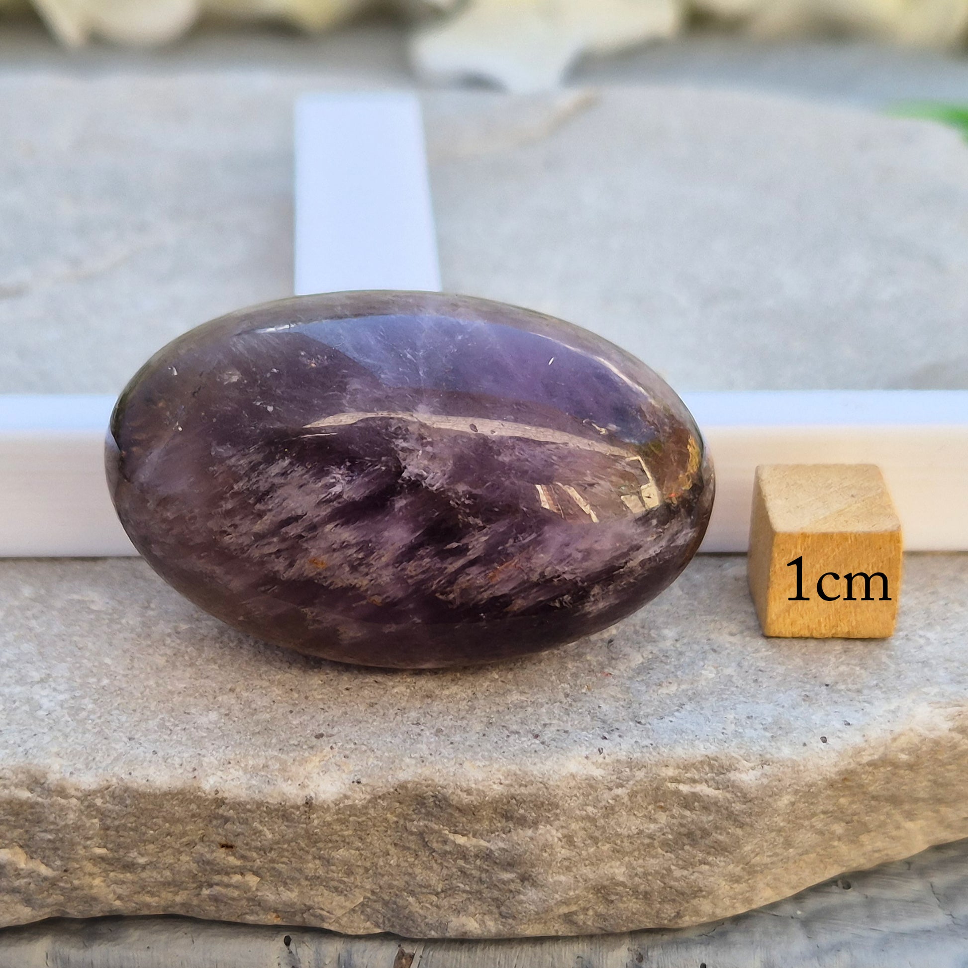 Natural Ametrine palm stone with subtle colour mix and organic inclusions. A smooth, easy-to-hold crystal for focus, balance, and direction. 