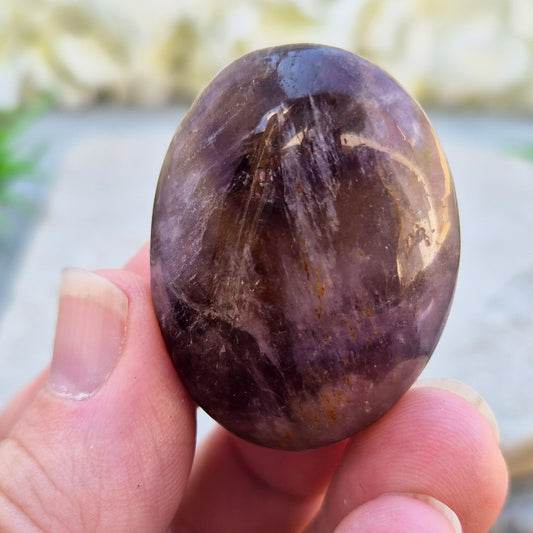 Ametrine polished palm stone with soft purple and golden tones. A natural blend of Amethyst and Citrine with a balanced, easy feel. 