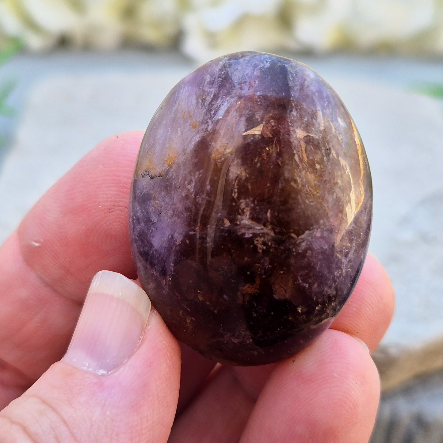 Ametrine polished palm stone with soft purple and golden tones. A natural blend of Amethyst and Citrine with a balanced, easy feel. 