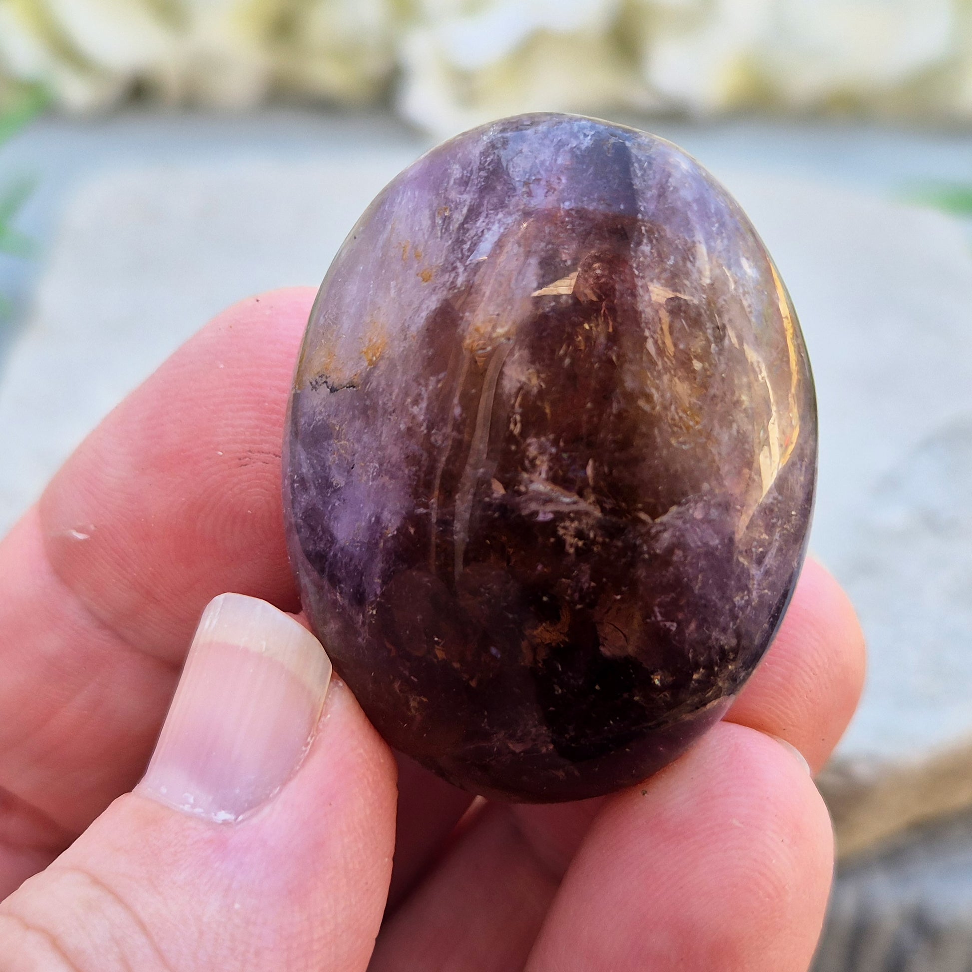 Ametrine polished palm stone with soft purple and golden tones. A natural blend of Amethyst and Citrine with a balanced, easy feel. 