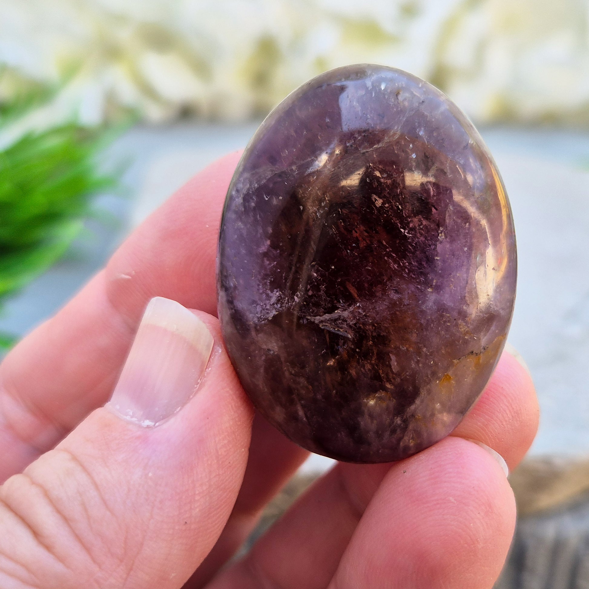 Ametrine polished palm stone with soft purple and golden tones. A natural blend of Amethyst and Citrine with a balanced, easy feel. 