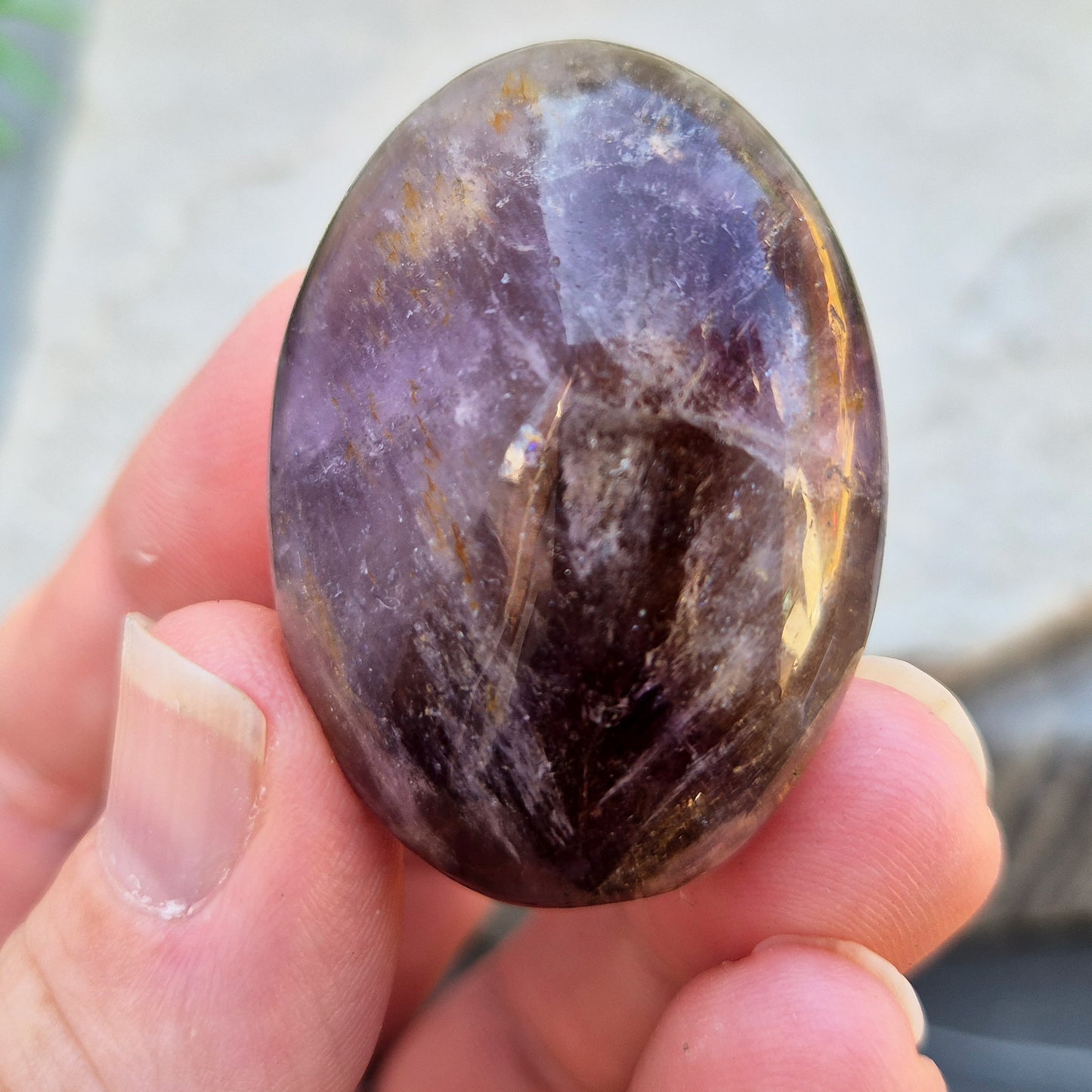 Ametrine polished palm stone with soft purple and golden tones. A natural blend of Amethyst and Citrine with a balanced, easy feel. 