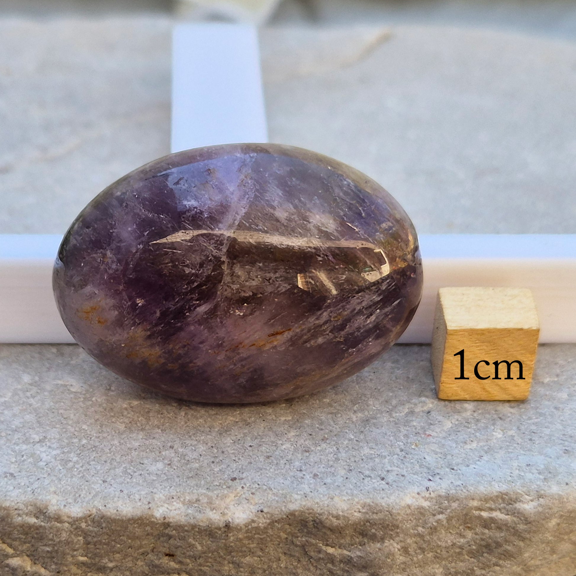 Ametrine polished palm stone with soft purple and golden tones. A natural blend of Amethyst and Citrine with a balanced, easy feel. 