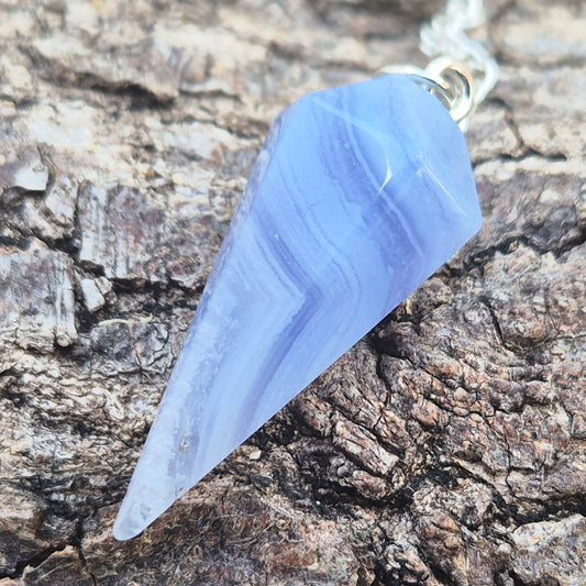 Blue Lace Agate crystal pendulum, known for its calming energy. Ideal for dowsing, spiritual guidance, and bringing a steady, peaceful feel.