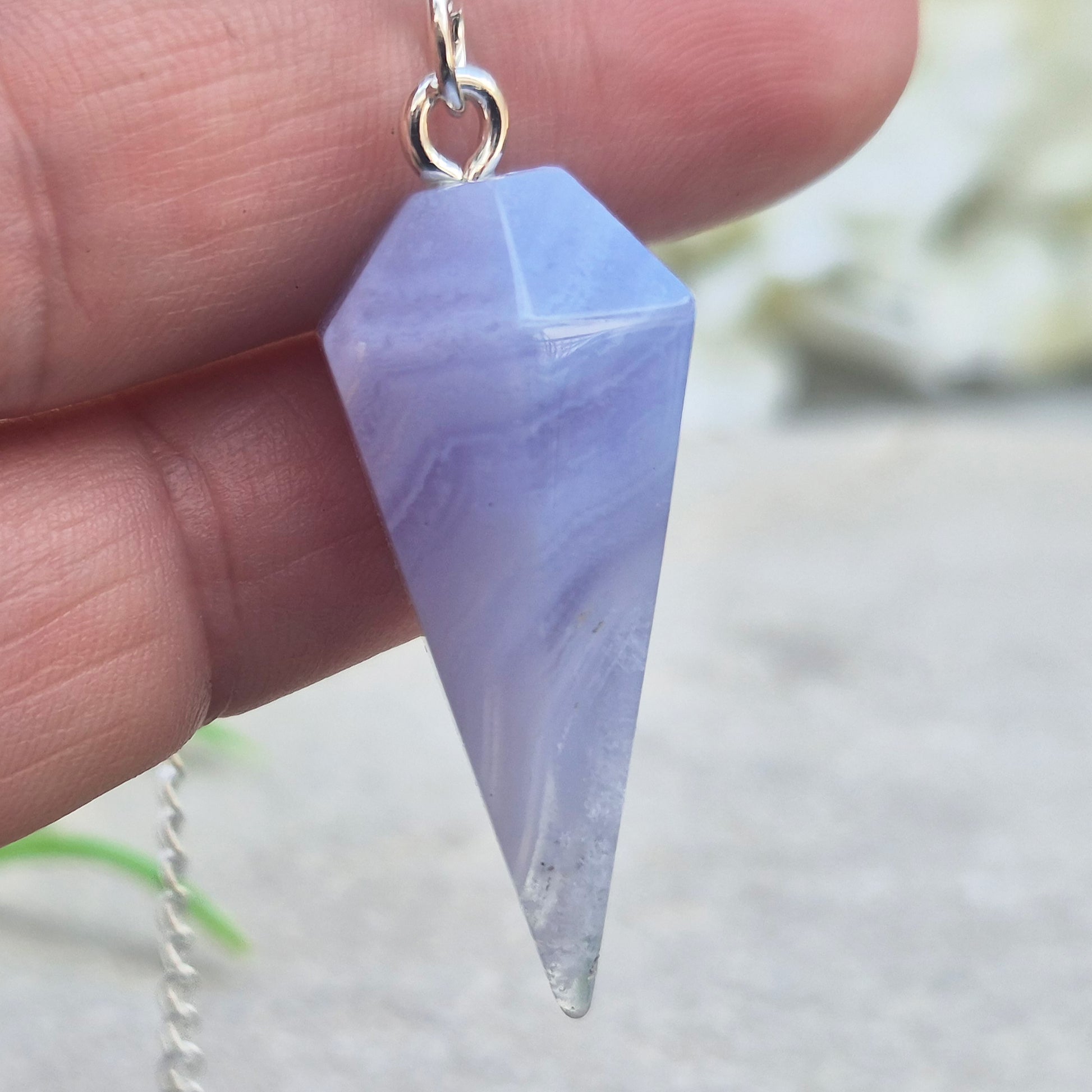 Blue Lace Agate crystal pendulum, known for its calming energy. Ideal for dowsing, spiritual guidance, and bringing a steady, peaceful feel.