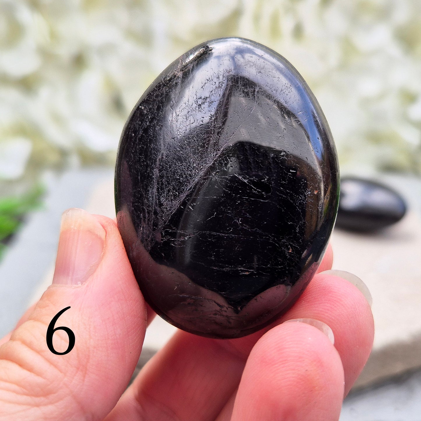 Black Tourmaline Palm Stone, Grounding and protective for everyday energy support. Ideal for shielding from negativity and promoting inner strength.