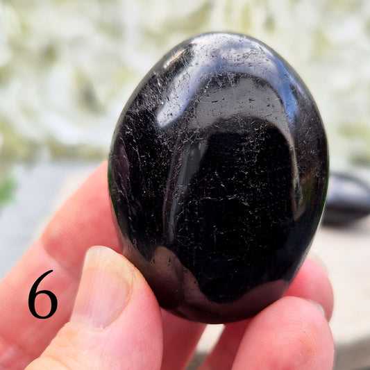 Black Tourmaline Palm Stone, Grounding and protective for everyday energy support. Ideal for shielding from negativity and promoting inner strength.