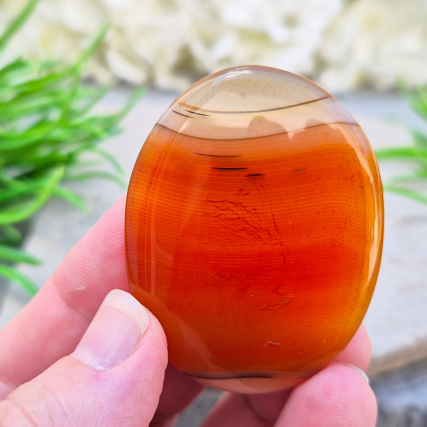 Banded Carnelian palm stone from Madagascar. Boosts motivation, confidence and creativity. Grounding Root and Sacral crystal for energy and focus