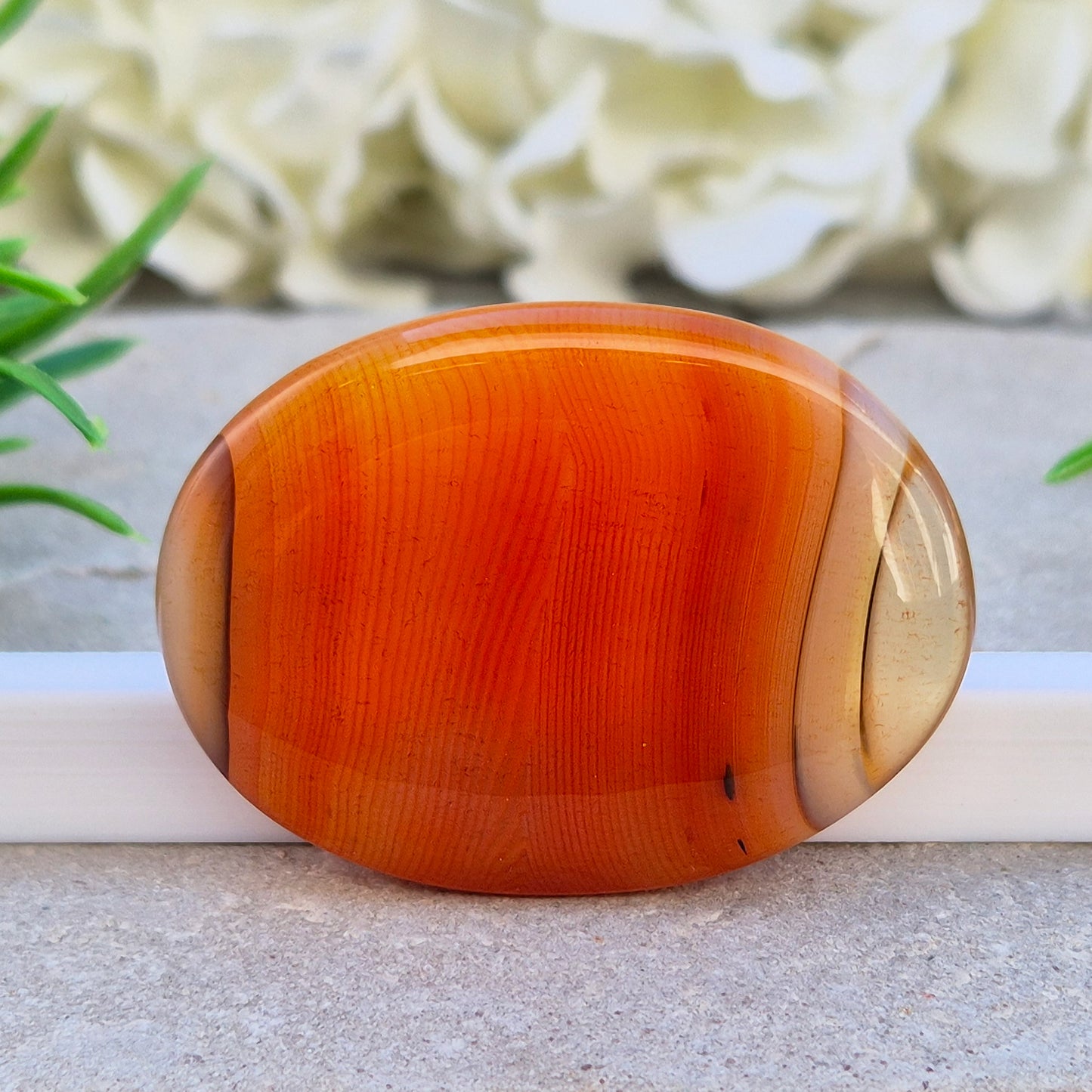 Banded Carnelian palm stone from Madagascar. Boosts motivation, confidence and creativity. Grounding Root and Sacral crystal for energy and focus