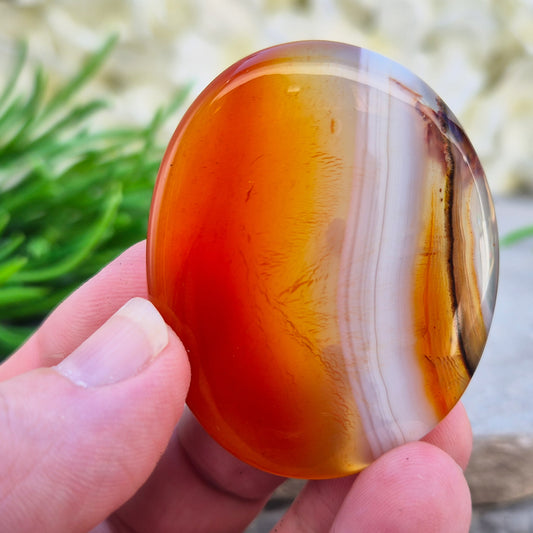 Banded Carnelian palm stone from Madagascar. Boosts motivation, confidence and creativity. Grounding Root and Sacral crystal for energy and focus