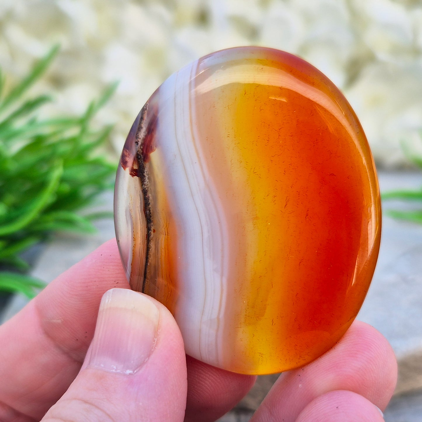Banded Carnelian palm stone from Madagascar. Boosts motivation, confidence and creativity. Grounding Root and Sacral crystal for energy and focus