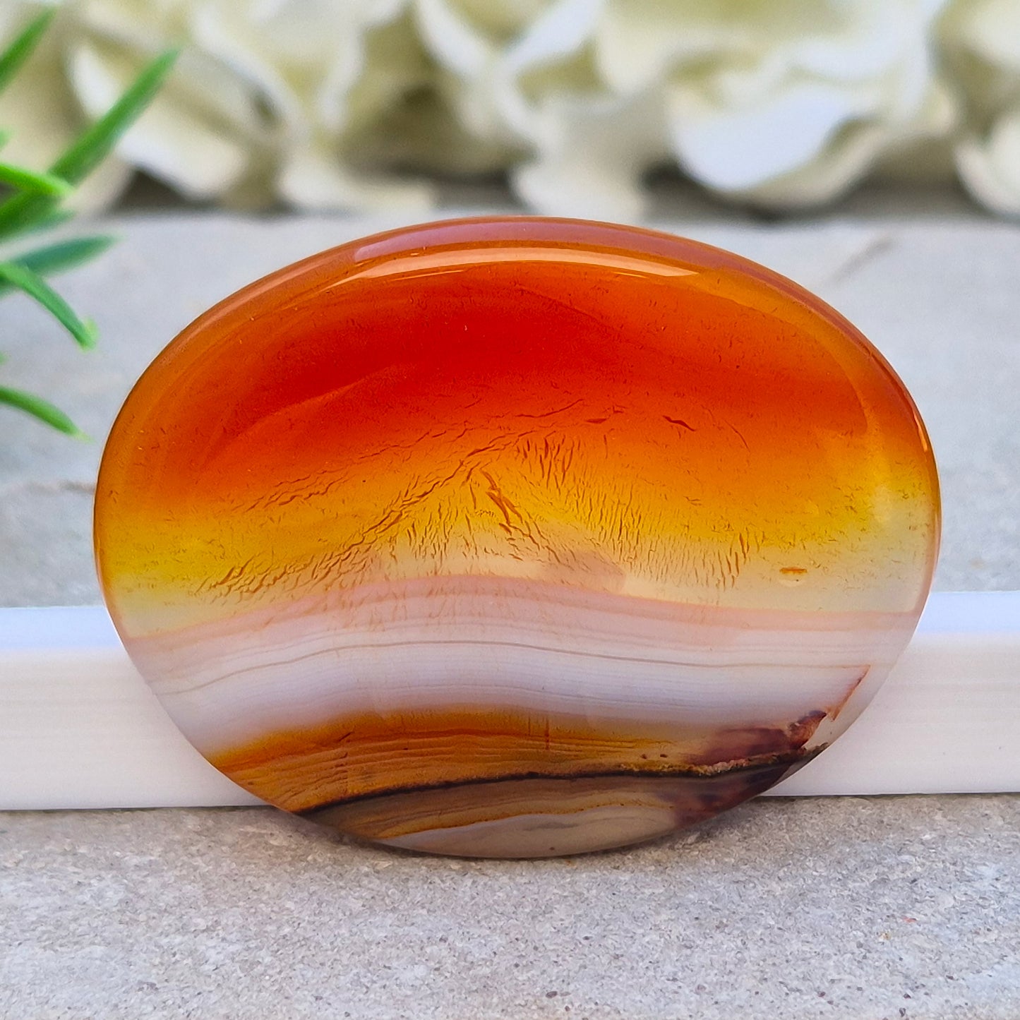 Banded Carnelian palm stone from Madagascar. Boosts motivation, confidence and creativity. Grounding Root and Sacral crystal for energy and focus