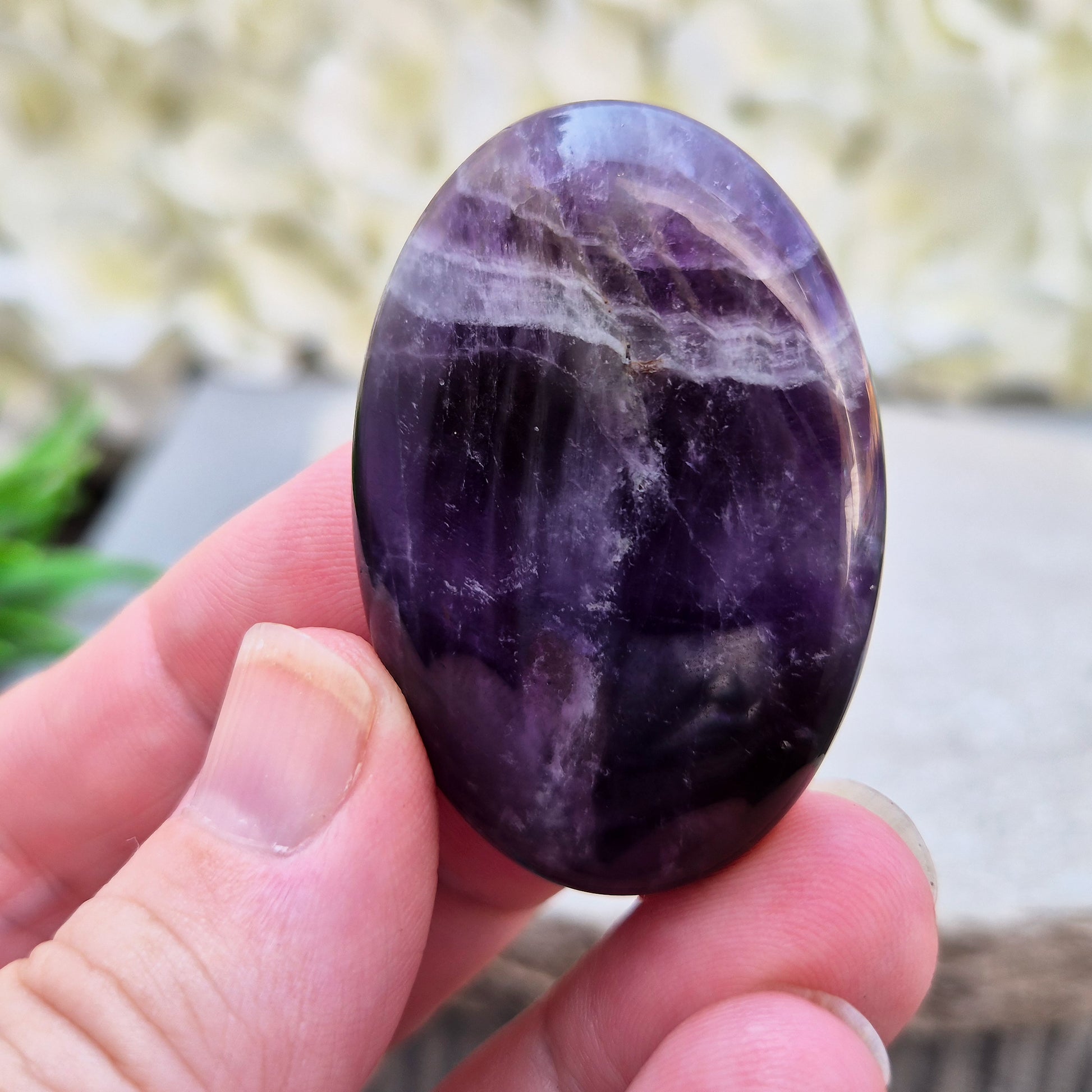 Amethyst Palm Stone with deep purple tones. A soothing crystal for balance, peaceful energy, and gentle spiritual connection. 