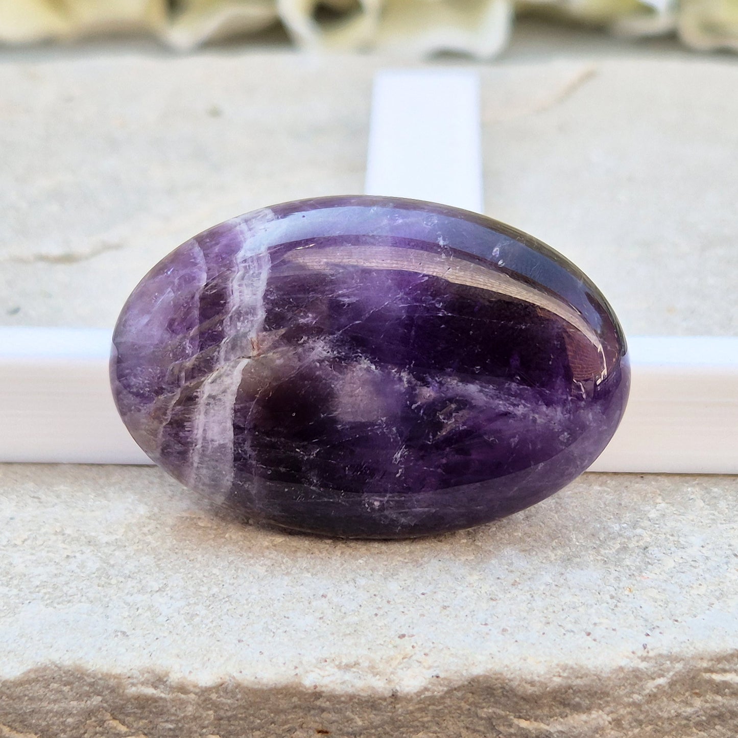 Amethyst Palm Stone with deep purple tones. A soothing crystal for balance, peaceful energy, and gentle spiritual connection. 