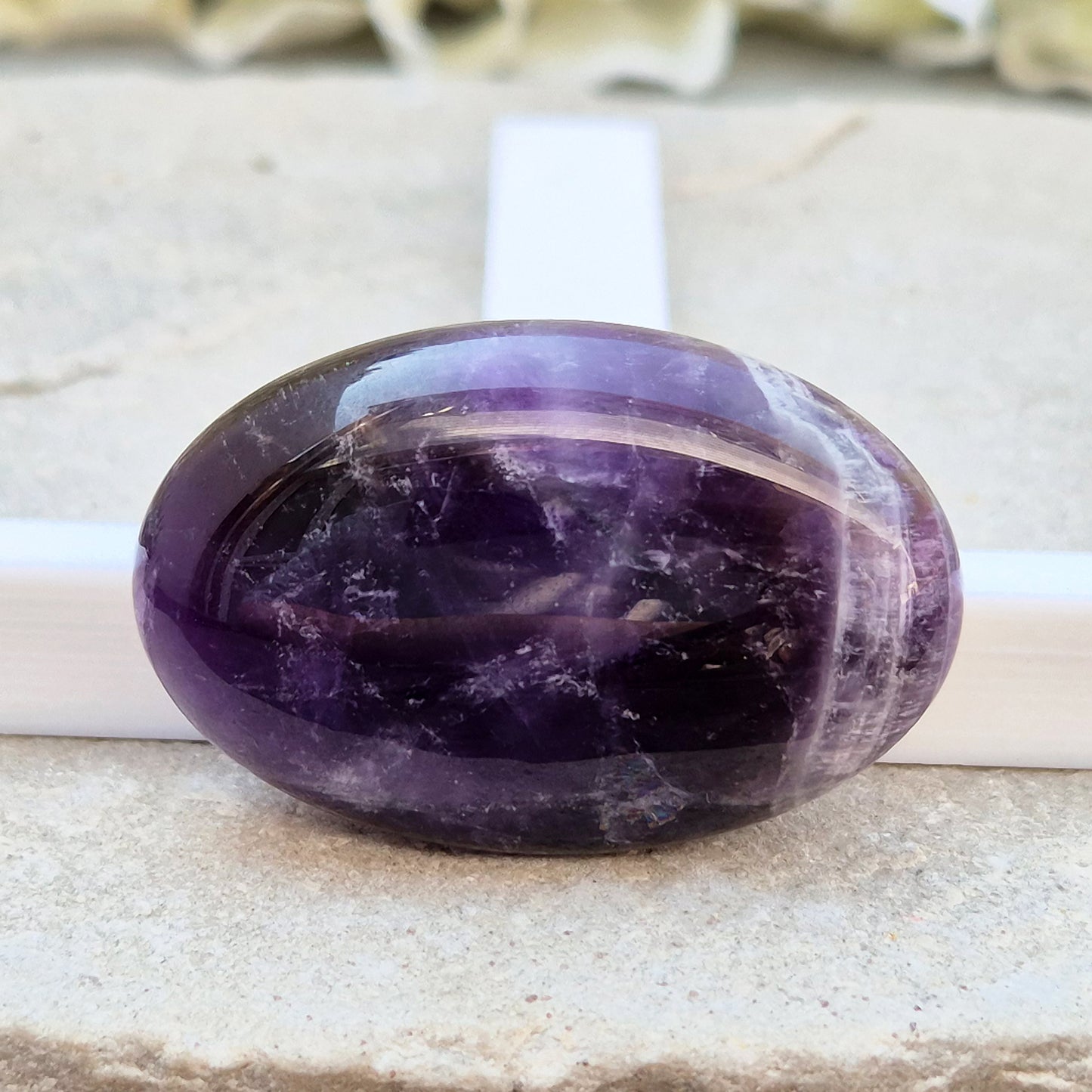 Amethyst Palm Stone with deep purple tones. A soothing crystal for balance, peaceful energy, and gentle spiritual connection. 