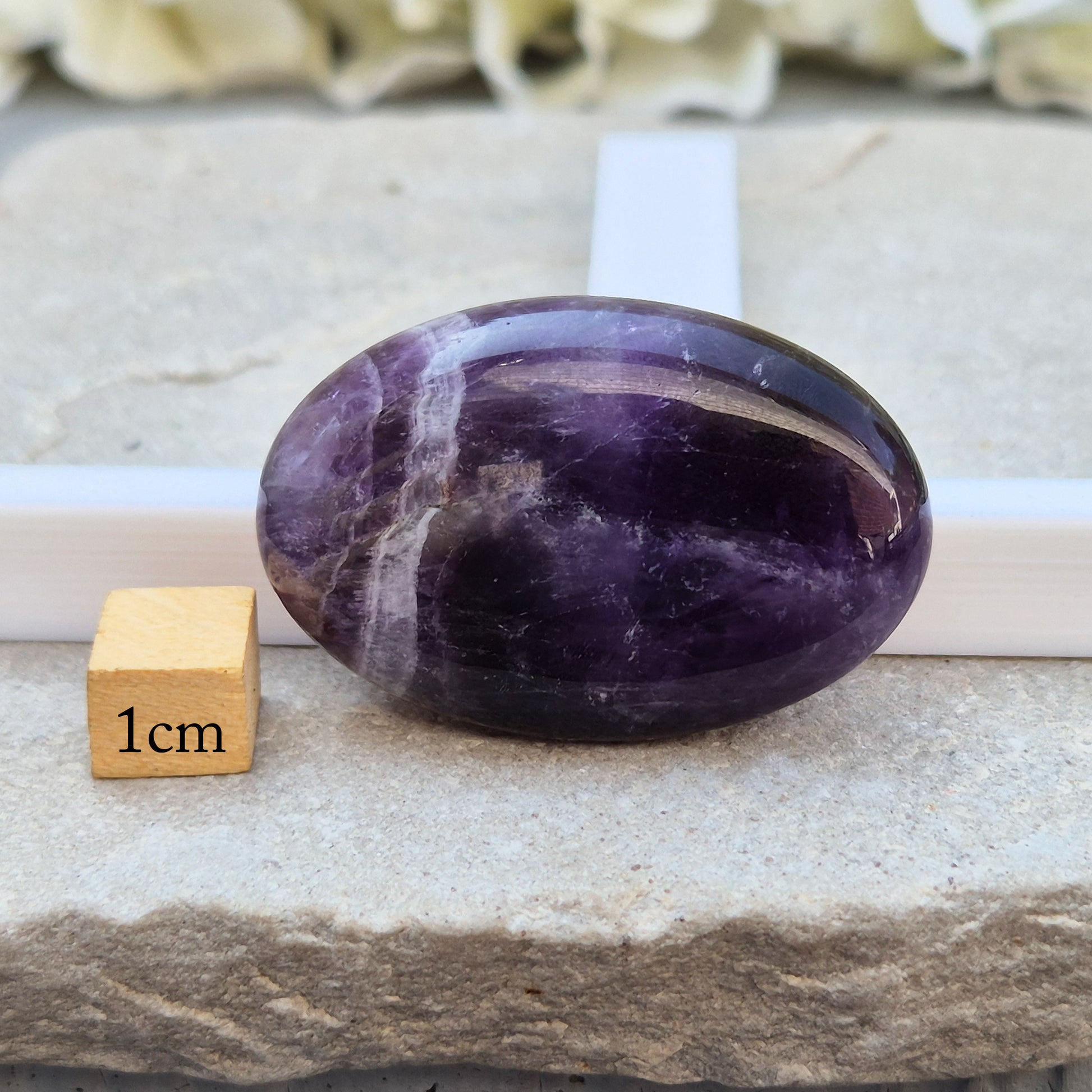 Amethyst Palm Stone with deep purple tones. A soothing crystal for balance, peaceful energy, and gentle spiritual connection. 