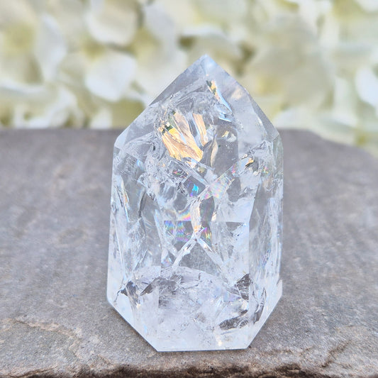 Fire and Ice Quartz polished point with striking internal crackle patterns. A high-energy crystal for amplification, focus, and energising your space.