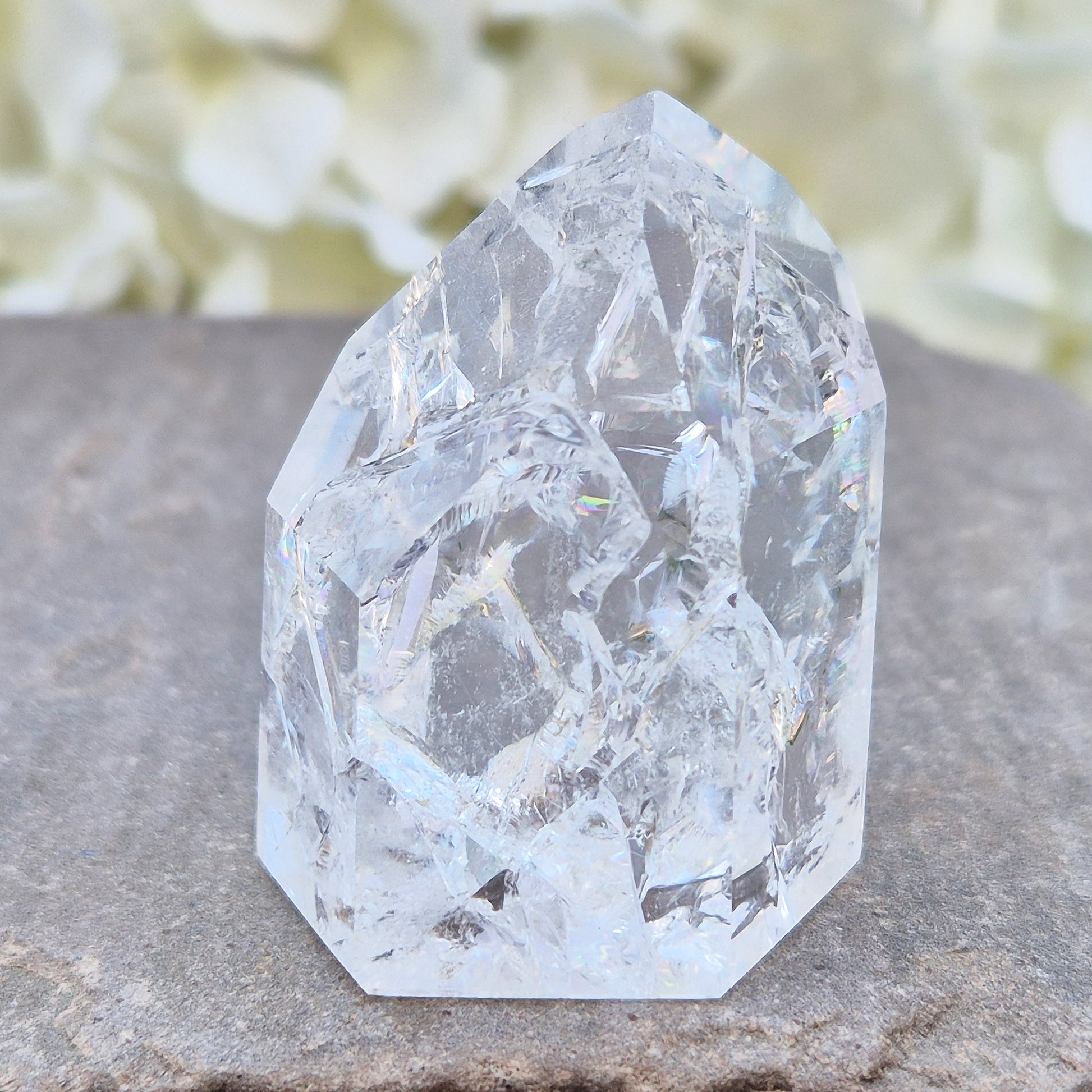 Fire and Ice Quartz polished point with striking internal crackle patterns. A high-energy crystal for amplification, focus, and energising your space.