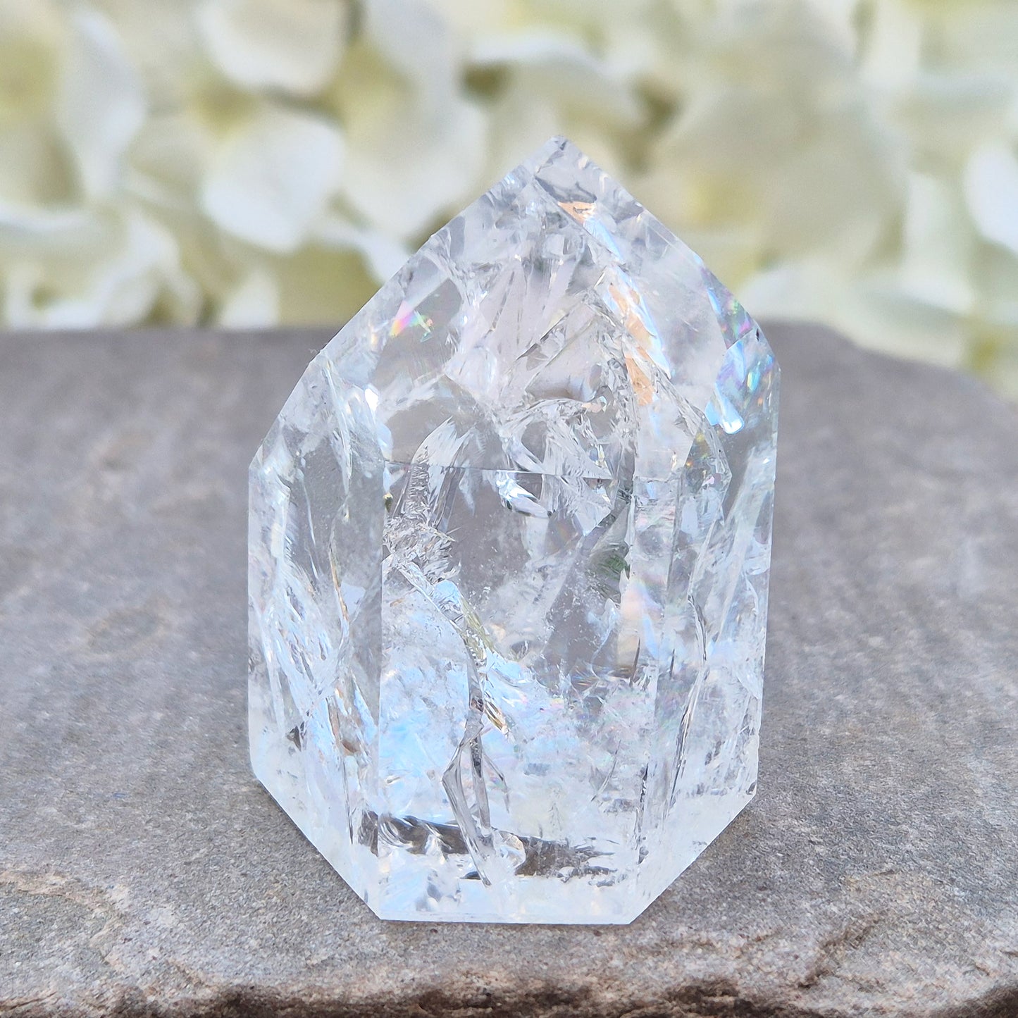 Fire and Ice Quartz polished point with striking internal crackle patterns. A high-energy crystal for amplification, focus, and energising your space.