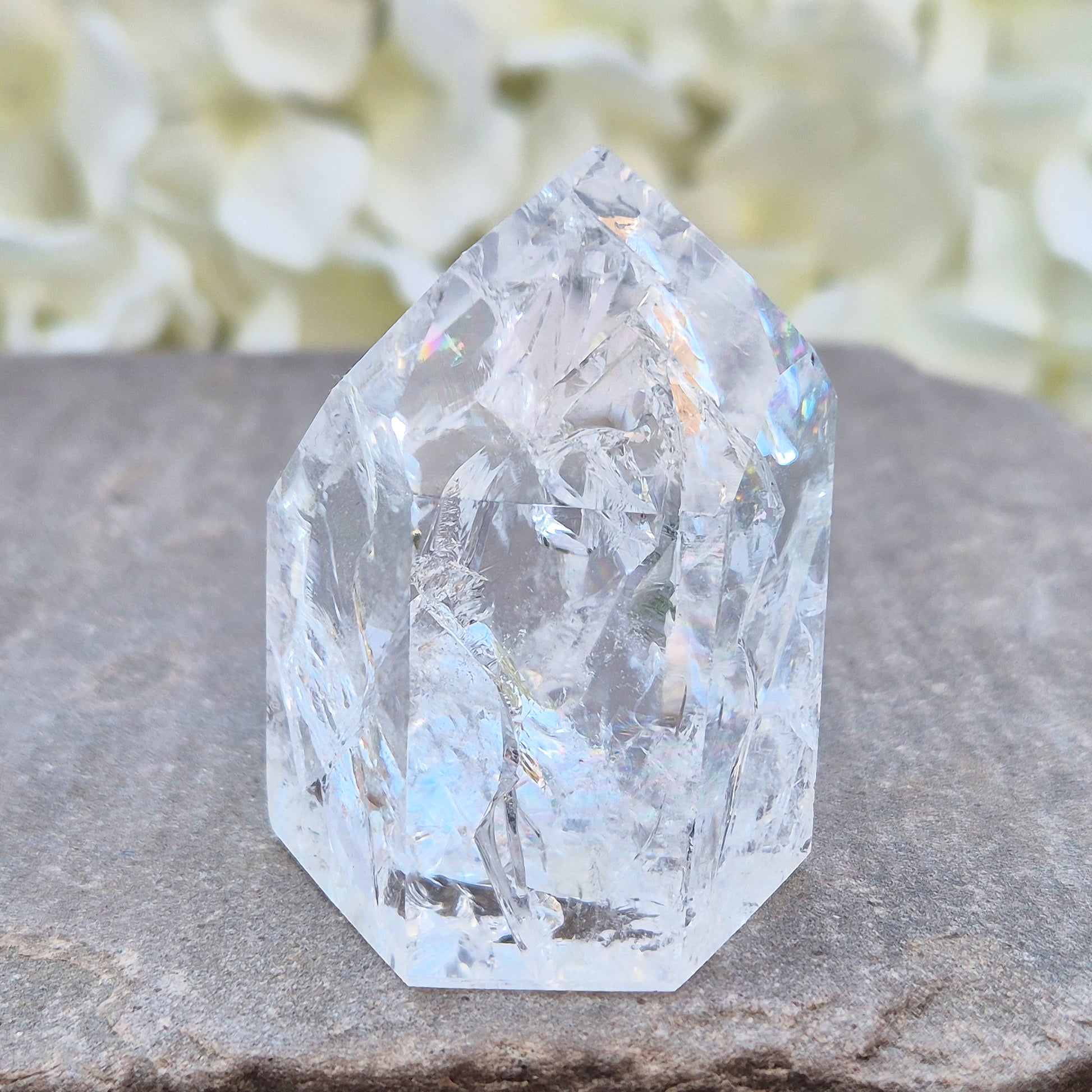 Fire and Ice Quartz polished point with striking internal crackle patterns. A high-energy crystal for amplification, focus, and energising your space.