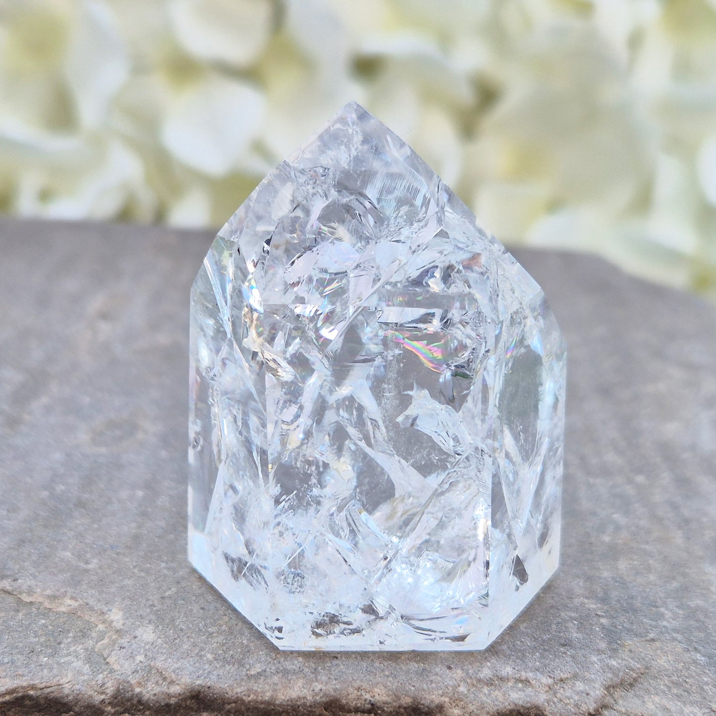 Fire and Ice Quartz polished point with striking internal crackle patterns. A high-energy crystal for amplification, focus, and energising your space.