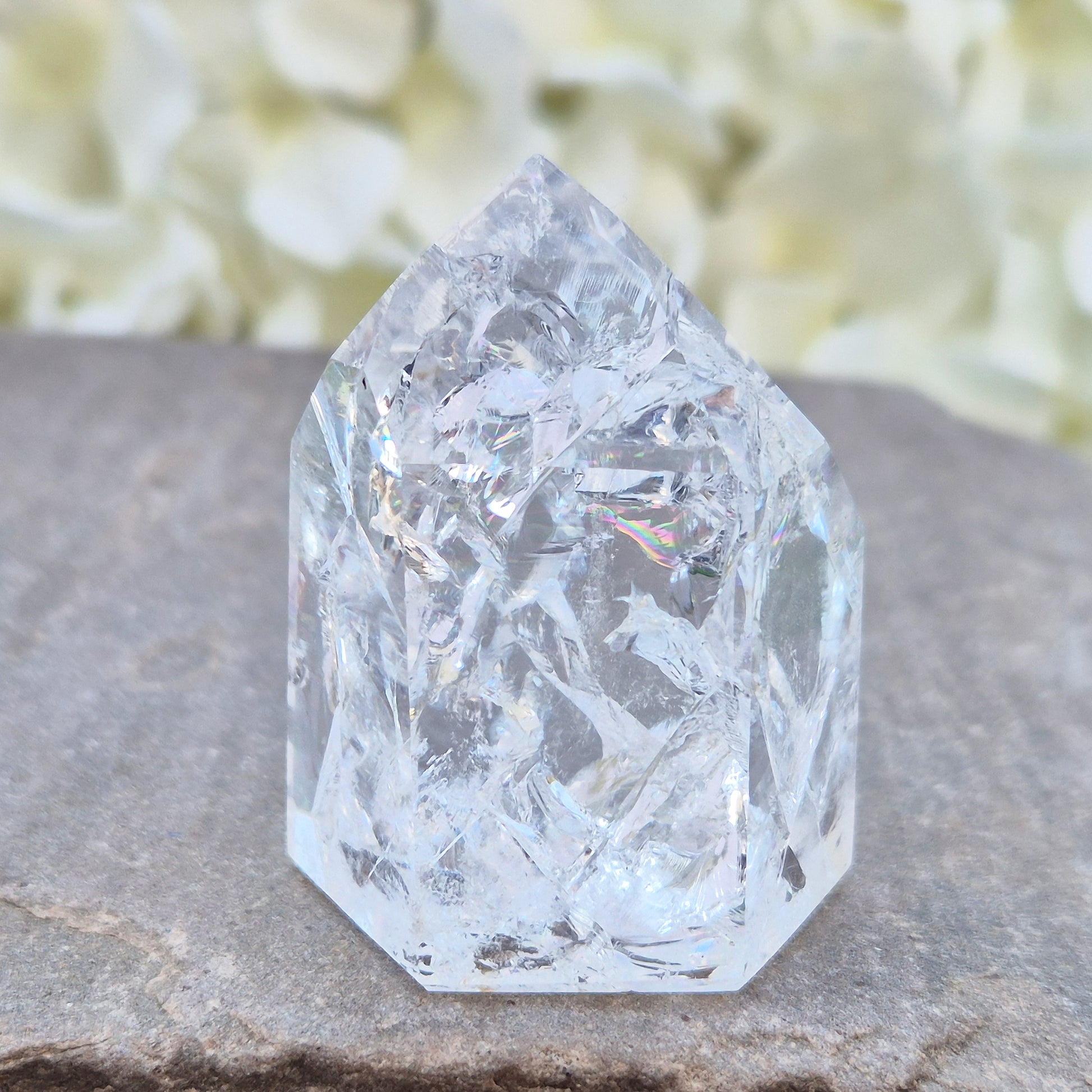 Fire and Ice Quartz polished point with striking internal crackle patterns. A high-energy crystal for amplification, focus, and energising your space.