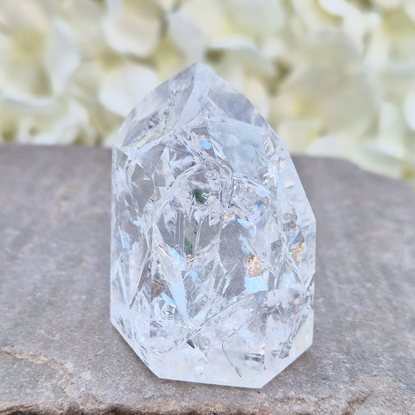 Fire and Ice Quartz polished point with striking internal crackle patterns. A high-energy crystal for amplification, focus, and energising your space.