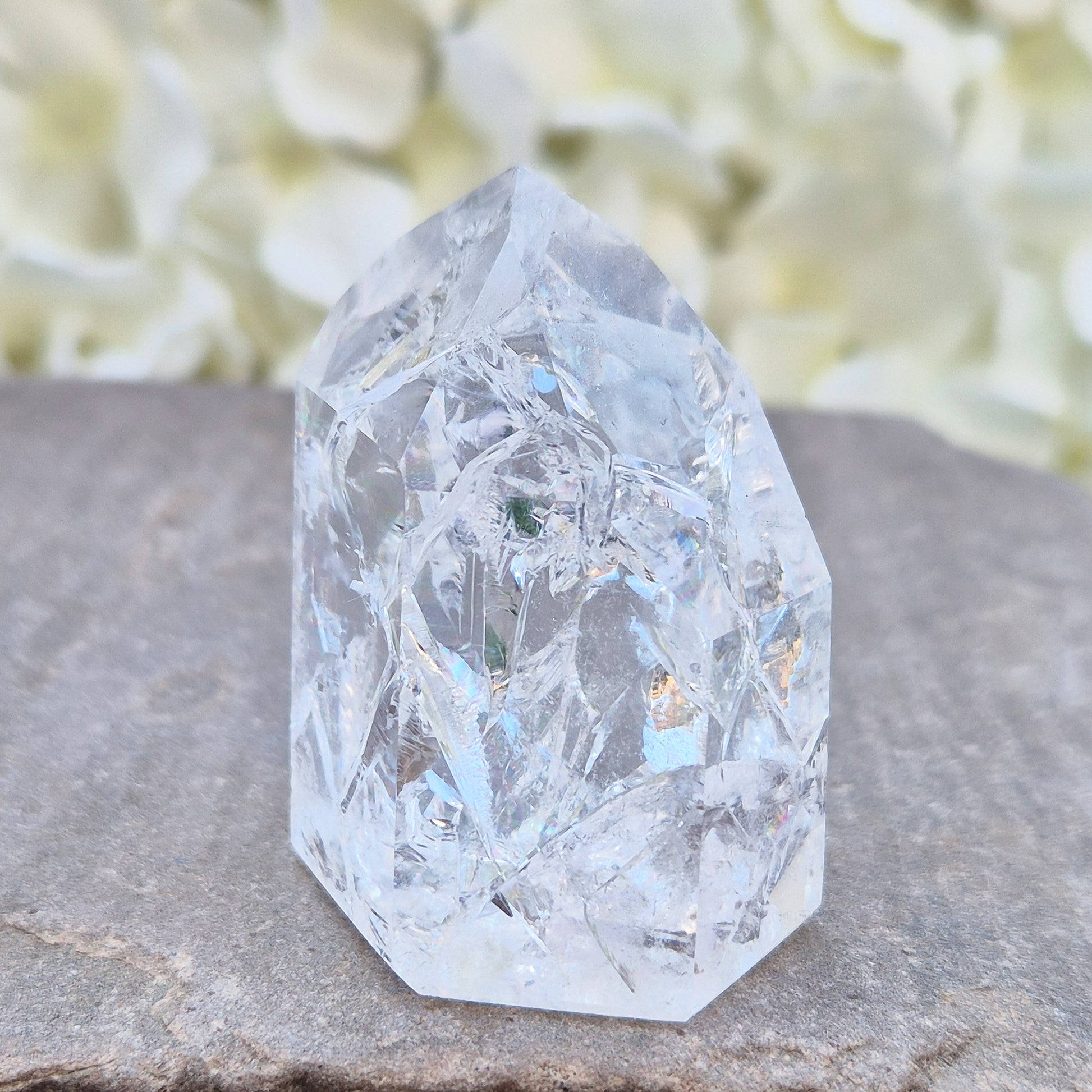 Fire and Ice Quartz polished point with striking internal crackle patterns. A high-energy crystal for amplification, focus, and energising your space.