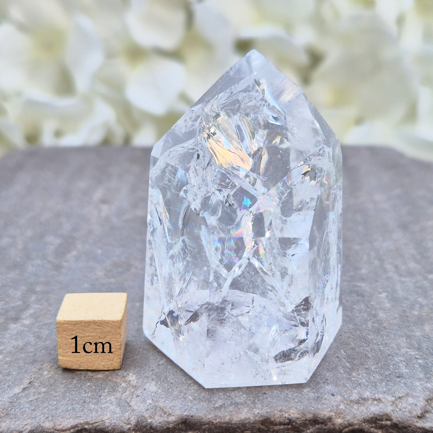 Fire and Ice Quartz polished point with striking internal crackle patterns. A high-energy crystal for amplification, focus, and energising your space.